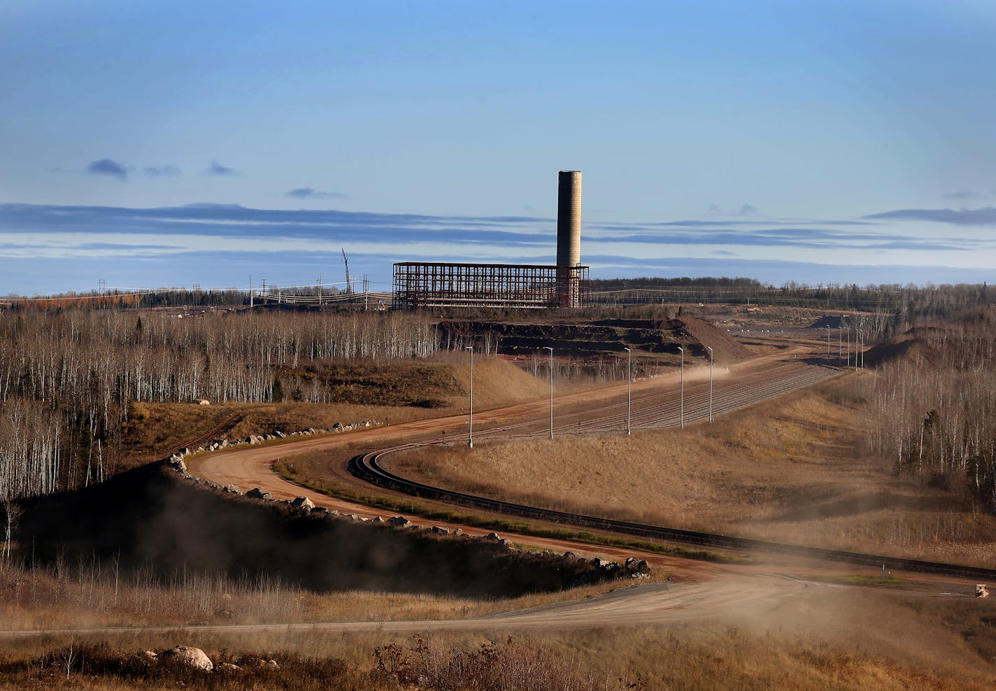 The stacks and the steel frame for the induration building are seen on the site of Essar Steel Minnesota's taconite mine project in Nashwauk, Minn. ] LEILA NAVIDI leila.navidi@startribune.com / BACKGROUND INFORMATION: Friday, October 31, 2014. Essar Steel Minnesota recently ramped up construction on an $1.8 billion taconite plant after securing the funding needed to complete the project. The plant endured several delays over the past two years as funds periodically ran dry and some contractors w