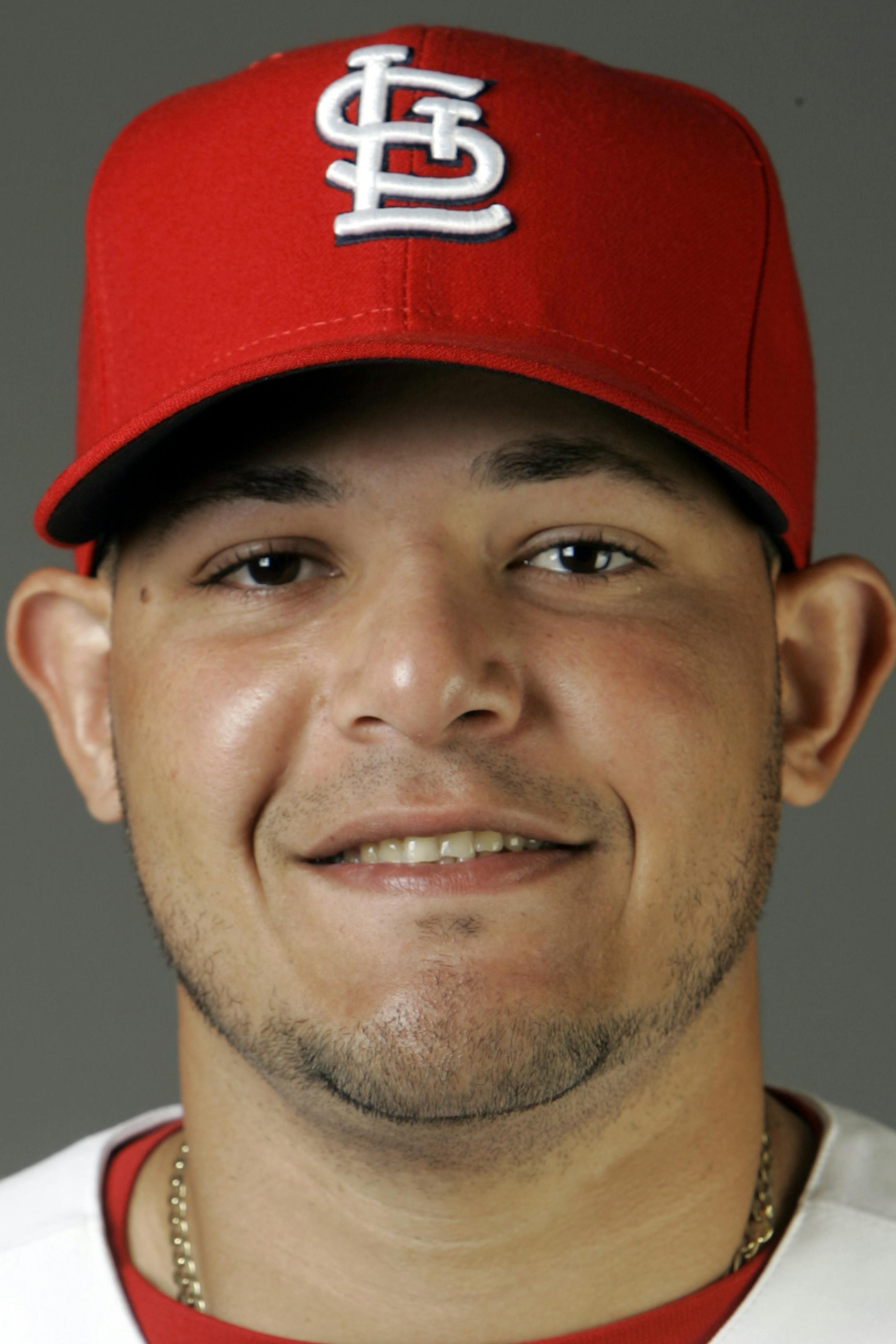 FILE -- This is a 2009 file photo showing St. Louis Cardinals baseball player Yadier Molina. A New York sports marketing firm has sued St. Louis Cardinals catcher Yadier Molina, saying he snubbed their agreement to make appearances and sign autographs. Steiner Sports Marketing's lawsuit, filed Friday, Oct. 13, 2009, in New York, says the sports memorabilia company had a contract with Molina dating to October 2006. (AP Photo/Jeff Roberson, File) ORG XMIT: NY171