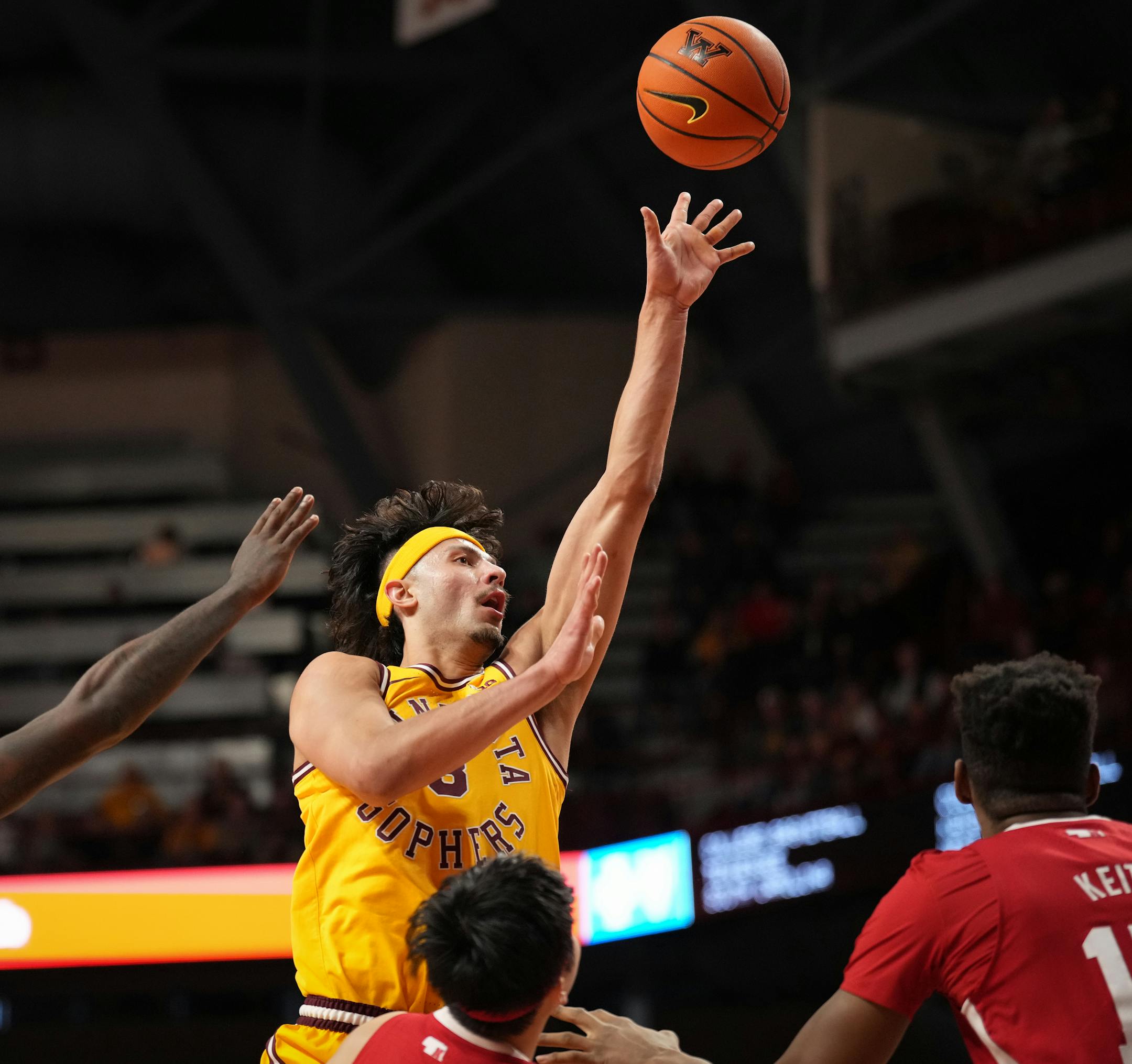 Minnesota Golden Gophers forward Dawson Garcia (3) pops a shot in the first half.