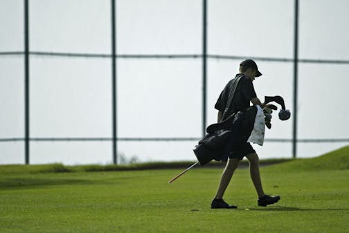 THOMAS WHISENAND*twhisenand@startribune.com 05/22/2007 ----- Roseville golfer Steve Bidne walks up to the first hole green during the Class 2A, Section 3 Championship at Keller Golf Course in Maplewood on Tuesday, May 22, 2007. Bidne three-putted the first hole but went on to qualify for the State Tournament. GENERAL INFORMATION: Roseville golfer Steve Bidne has a good chance to qualify for the Class 2A state tournament. If he does so, I will be writing a feature on him, or if a full-length stor