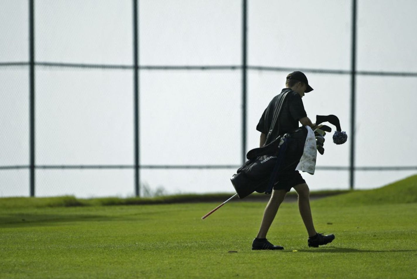 THOMAS WHISENAND*twhisenand@startribune.com 05/22/2007 ----- Roseville golfer Steve Bidne walks up to the first hole green during the Class 2A, Section 3 Championship at Keller Golf Course in Maplewood on Tuesday, May 22, 2007. Bidne three-putted the first hole but went on to qualify for the State Tournament. GENERAL INFORMATION: Roseville golfer Steve Bidne has a good chance to qualify for the Class 2A state tournament. If he does so, I will be writing a feature on him, or if a full-length stor
