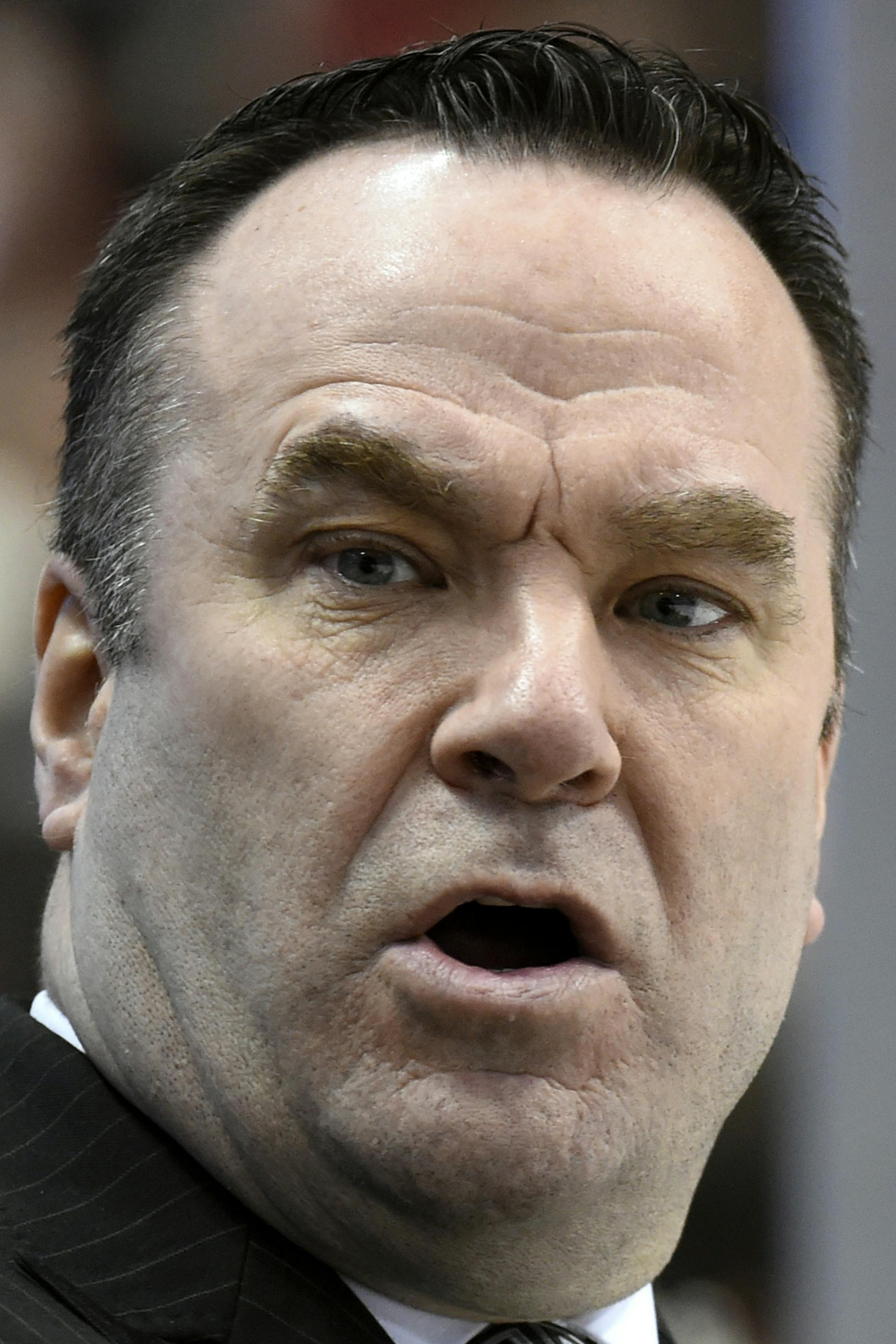 Minnesota Wild coach John Torchetti watches during the second period of the team's NHL hockey game against the Calgary Flames on Saturday, April 9, 2016, in St. Paul, Minn. (AP Photo/Hannah Foslien)