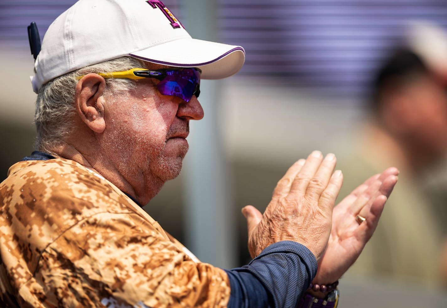 Former Vikings quarterback Tommy Kramer applauded after a speech by Mike Grant during a public celebration of for Minnesota Vikings coach Bud Grant.