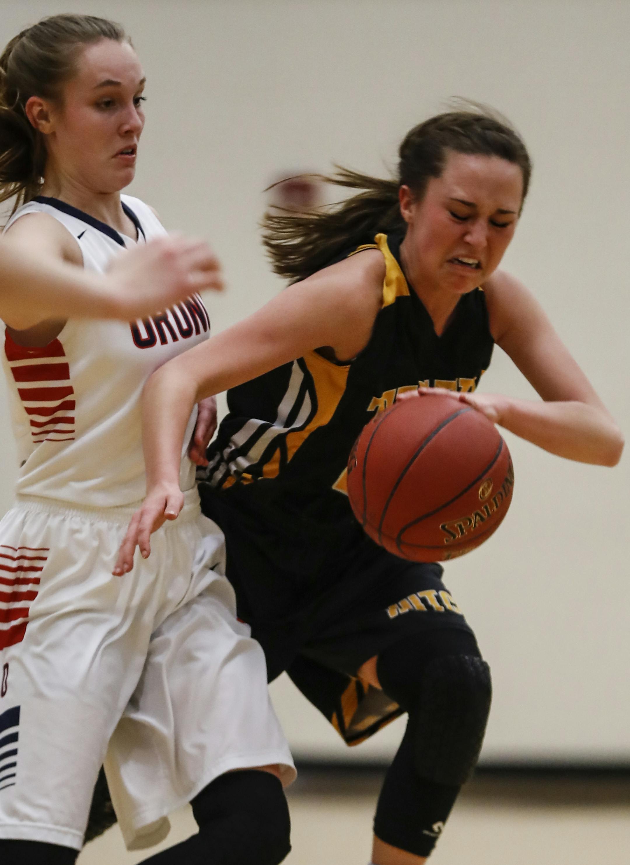 Orono's Anna Hughes (5) collided with Hutchinson's Elle Wheatley as she dribbled the ball in the first half on Thursday, March 9, 2017, at Chanhassen High School in Chanhassen, Minn. ] RENEE JONES SCHNEIDER • renee.jones@startribune.com Section final for class 3A Hutchinson vs. Orono
