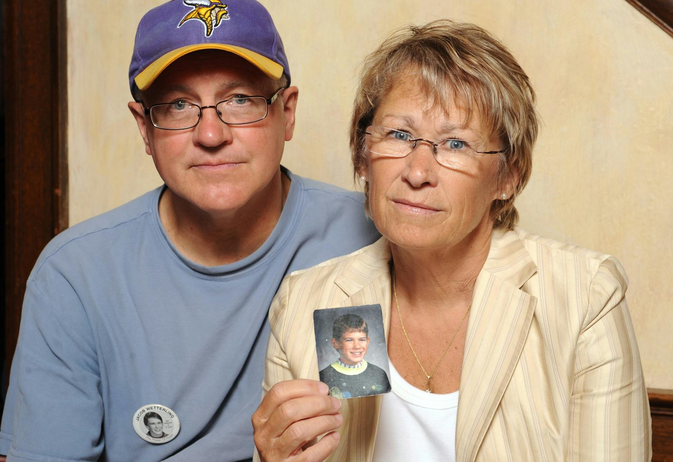 In this Aug. 28, 2009 photo, Jerry Wetterling and wife Patty, right, show a photo of their son Jacob Wetterling, who was abducted in October of 1989 in St. Joseph, Minn., and is still missing.