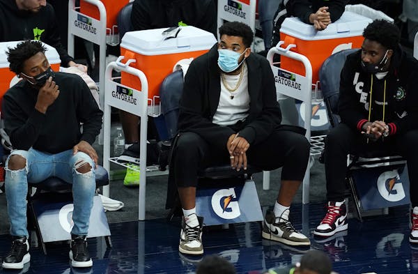 Timberwolves center Karl-Anthony Towns, out with a wrist injury, watched from the bench during a game earlier this month.