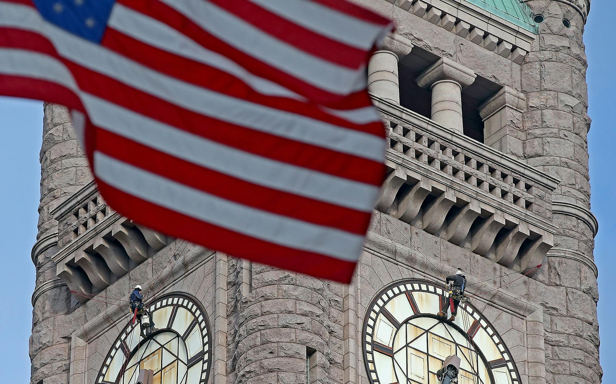 The historic clock atop City Hall stopped shortly after 6:30 a.m. to allow crew members to get inside the tower and gussy up the late-19th century landmark downtown, Monday, January 19, 2015 in Minneapolis, MN.