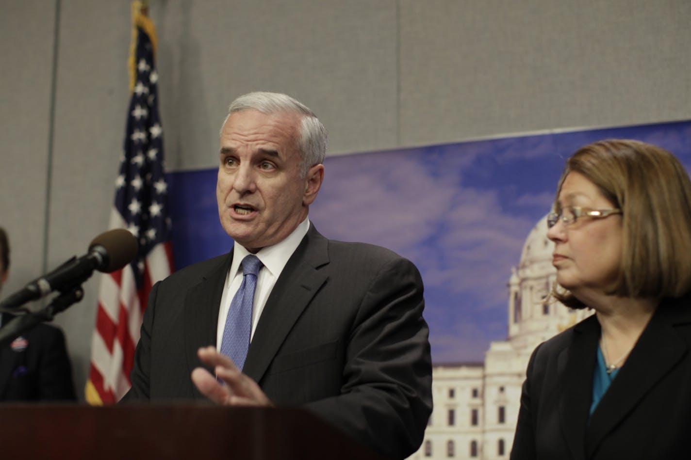 DFL gubernatorial candidate Mark Dayton addresses the press Wednesday afternoon. At right is running mate Yvonne Prettner Solon.