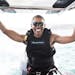 In this recent but undated photo made available by Virgin.com, former U.S President Barack Obama prepares to kitesurf during his stay on Moskito Islan