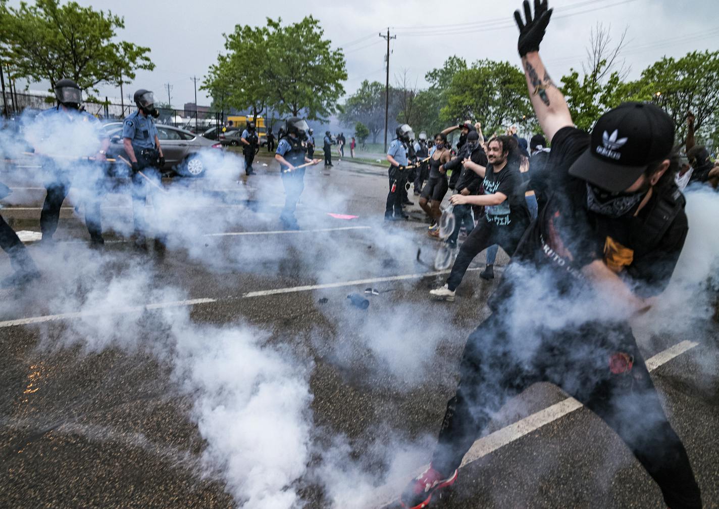 Most protesters were peaceful while a few started destroying police property. Peaceful protesters pleaded with those who resorted to violence to stop. Police secured the precinct from further property damage with riot police and tear gas.] George Lloyd, a middle-aged man died after a confrontation with Minneapolis on Monday evening. A bystander video that started circulating sometime after the incident appeared to show the man pleading with officers that he couldn't breathe as one officer knelt