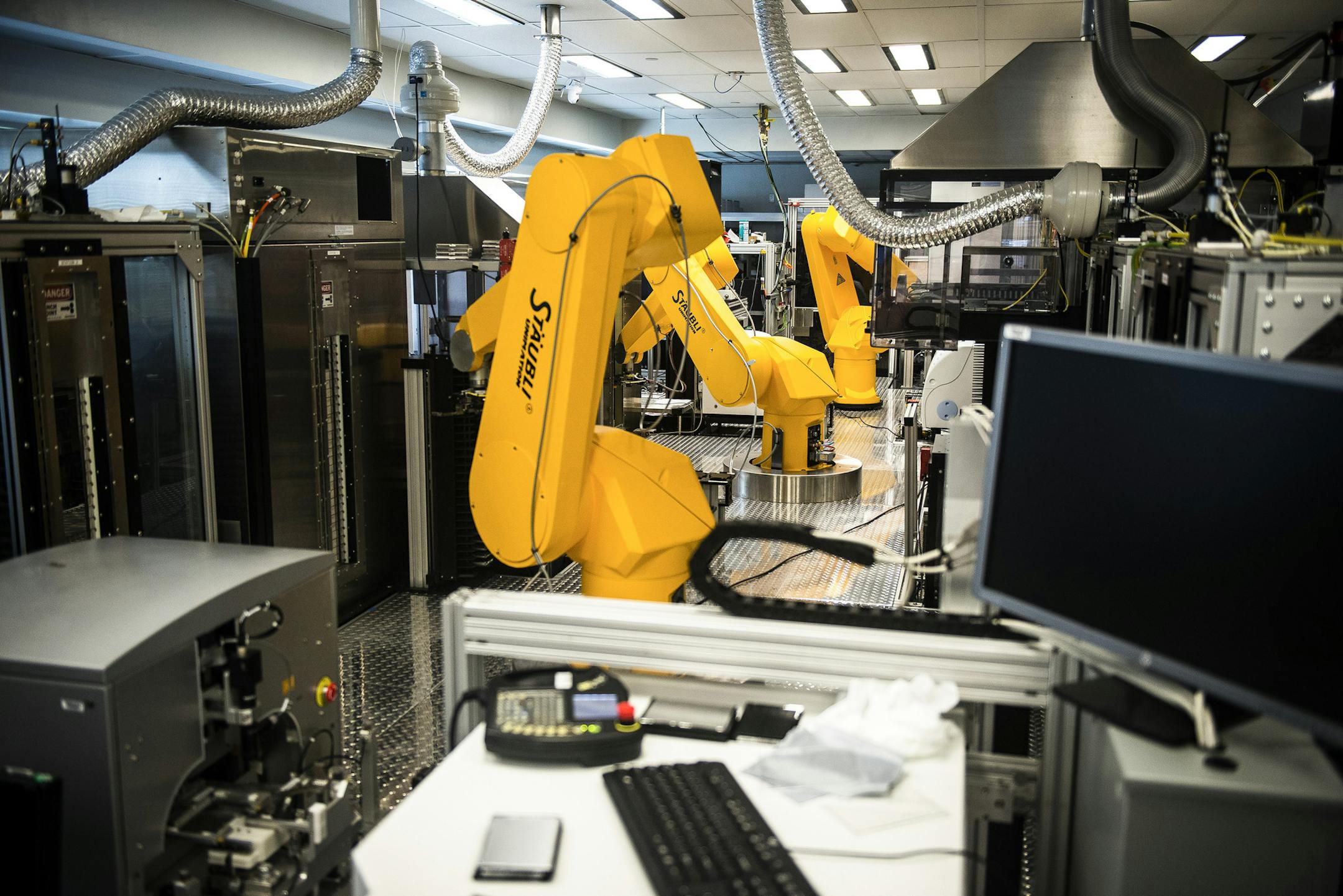 Robotic arms sort a library of drug compounds at the lab of the National Center for Advancing Translational Sciences, which is testing drugs on neural progenitor cells, hoping to find compounds that can stop the Zika virus, in Bethesda, Md., April 6, 2016. A graduate student’s offhand remark has led to widespread research of the virus that has provided findings about how it causes brain damage. (Gabriella Demczuk/The New York Times)