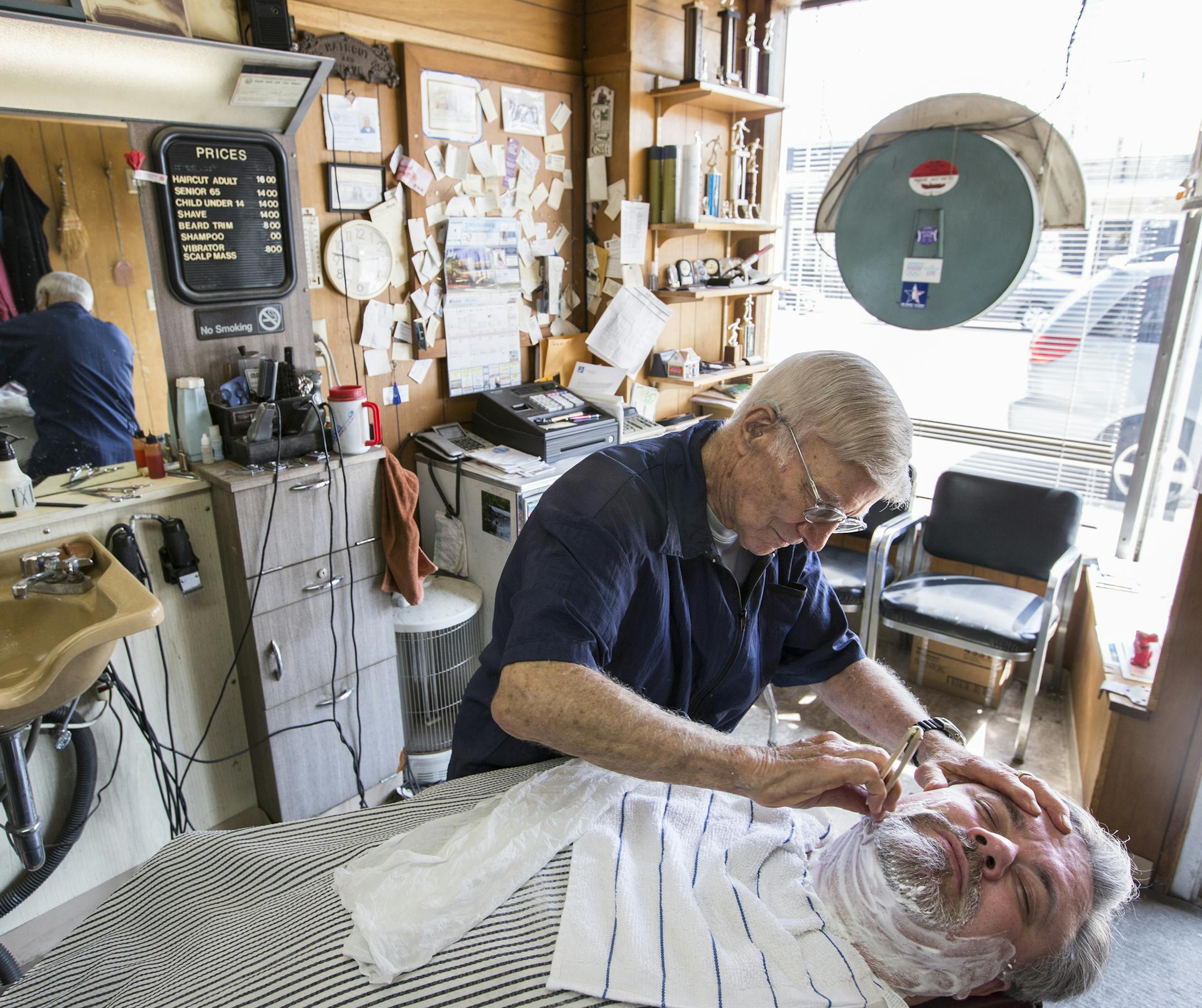 Jeff DeLozier gave Michael Perkins of St. Louis Park a shave at Jeff&#x2019;s Barber Shop, open since 1963 on Mainstreet in Hopkins.