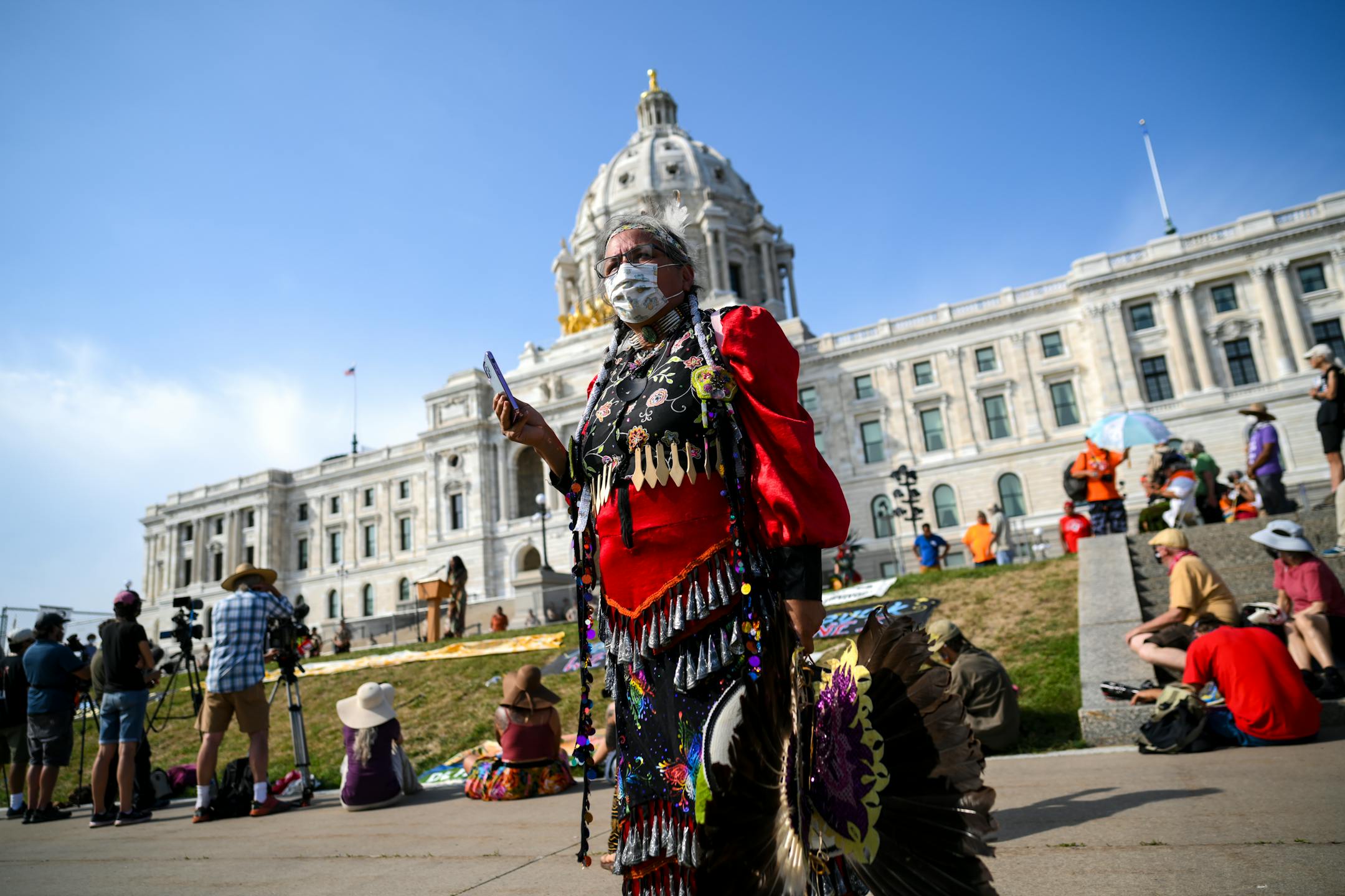 Lanna Jack, with the Celilo Wy'Am tribe from the Oregon Columbia River, took video of the protest in front of the Minnesota State Capitol Wednesday.