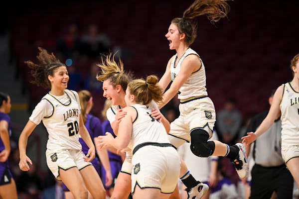 Providence Academy celebrates their 74-60 win over Albany Saturday, March 18, 2023 during the Class 2A girls' basketball state tournament championship