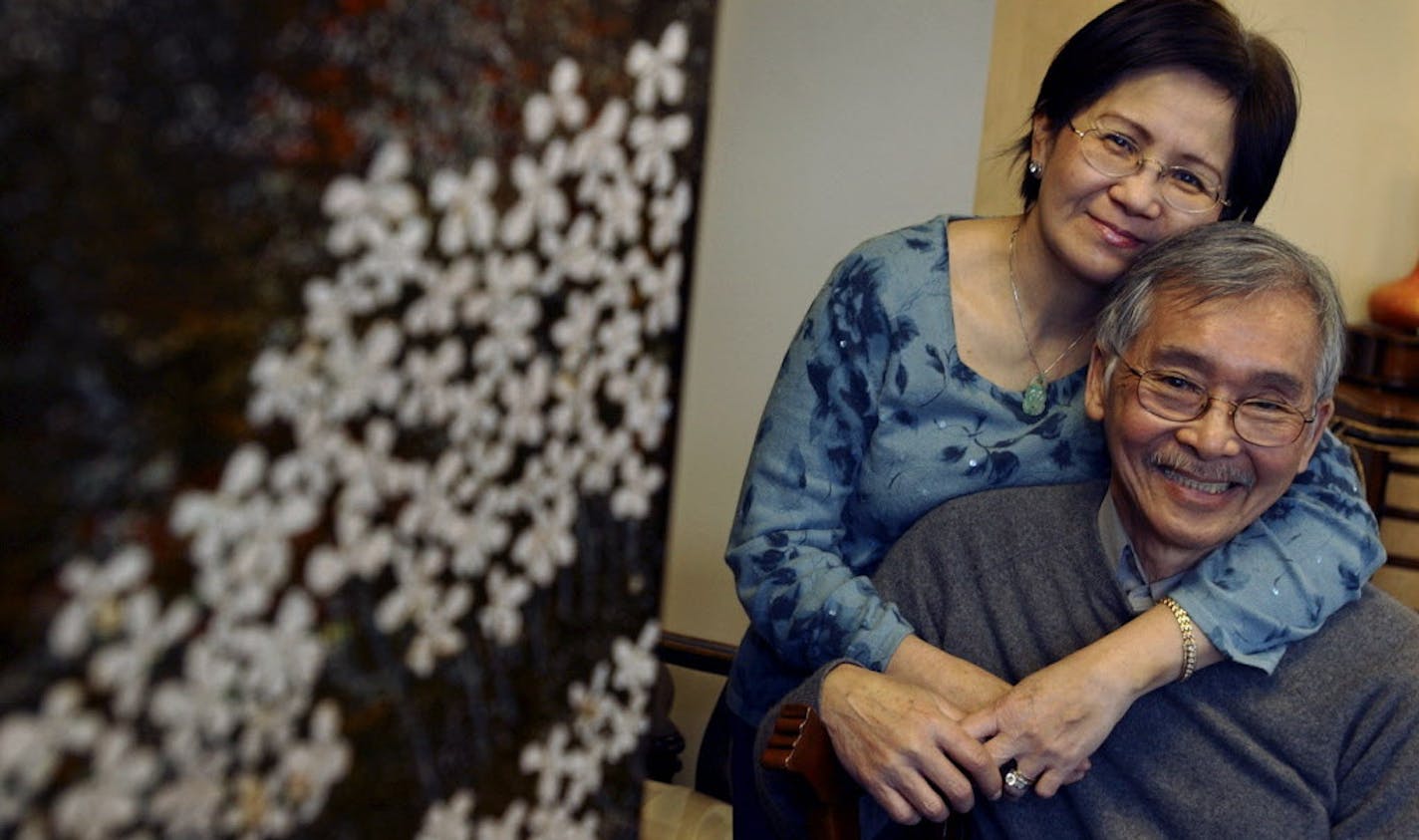 Joey McLeister &#xd4; jmcleister@startribune.com St. Paul,Mn.,Weds.,Dec. 7, 2005--(Left to right) My-Dung Nguyen and her husband, Ngoan Dang, own the Mai Village Vietnamese Cuisine Restaurant in St. Paul. The two maintain a positive outlook despite both having cancer. Both say they are each other's best friend. (At left is a decorative screen--part of the couple's vast collection of Asian art and antiques.) GENERAL INFORMATION: Profile of My-Dung Nguyen and Ngoan Dang who fled Vietnam 30 years a