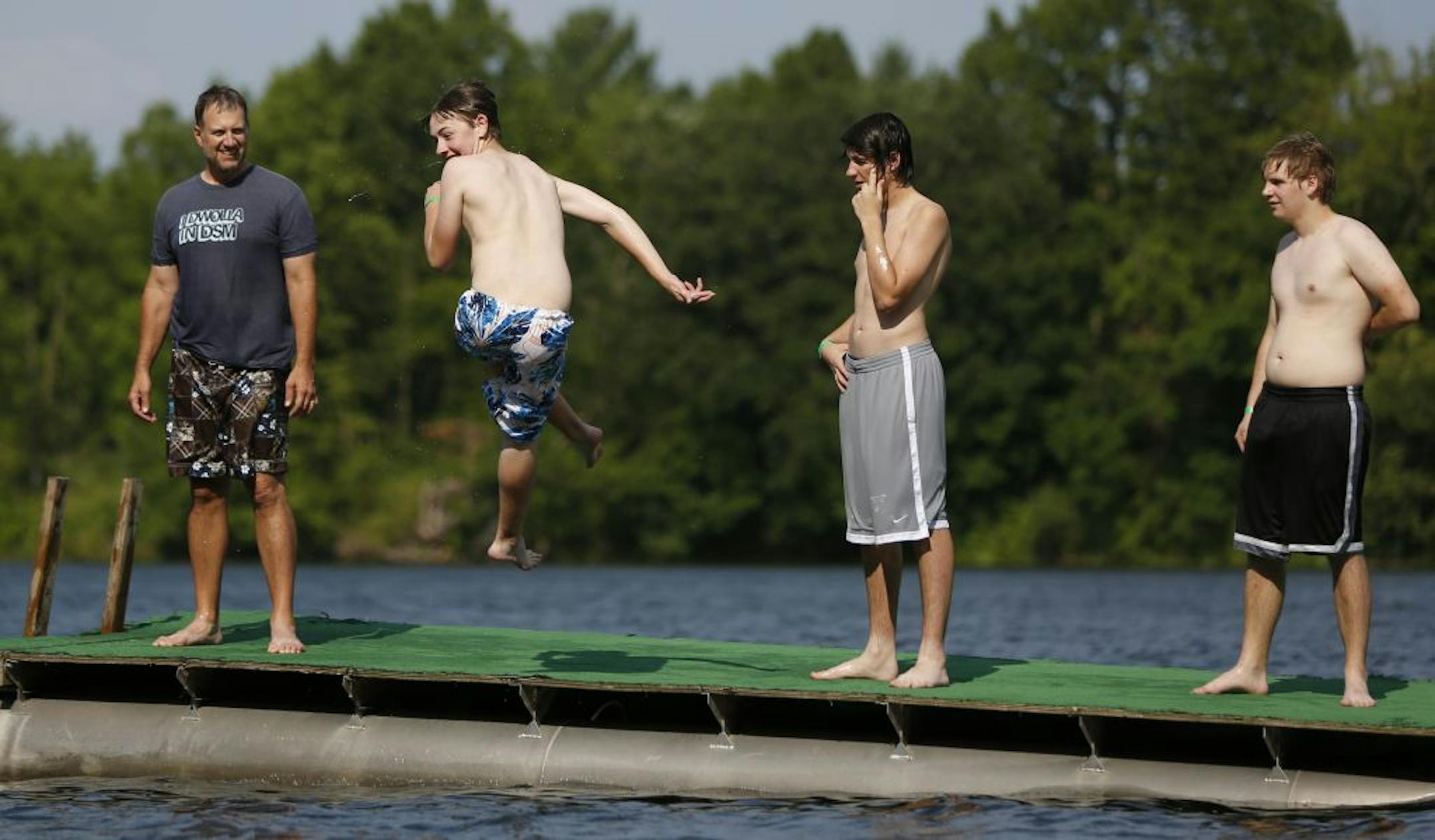 In Minnetrista, members of the Des Moines New Hope United Methodist Church enjoy a swim in Little Long Lake at Camp Kingswood. The camp has been a United Methodist Church-sponsored youth camp since 1947, but two weeks ago its board of directors voted to sell it. The 127-acre site borders one of the cleanest lakes in Hennepin County, with a rich forest and healthy wetlands that harbor loons, kingfishers and least bitterns. Three Rivers Park commissioners decided last Thursday to start negotiation