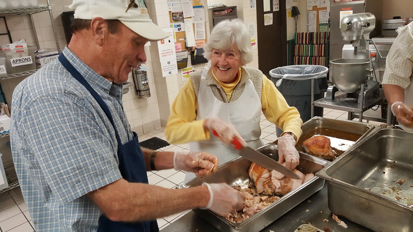 Arlene Leyden and Paul Sederstom, volunteers at Dorothy Day Center in downtown St. Paul, help carve 18 turkeys for the final Thanksgiving meal at the emergency homeless shelter. Catholic Charities will move the shelter to a new building and greatly expand its services.
Shannon Prather, Star Tribune