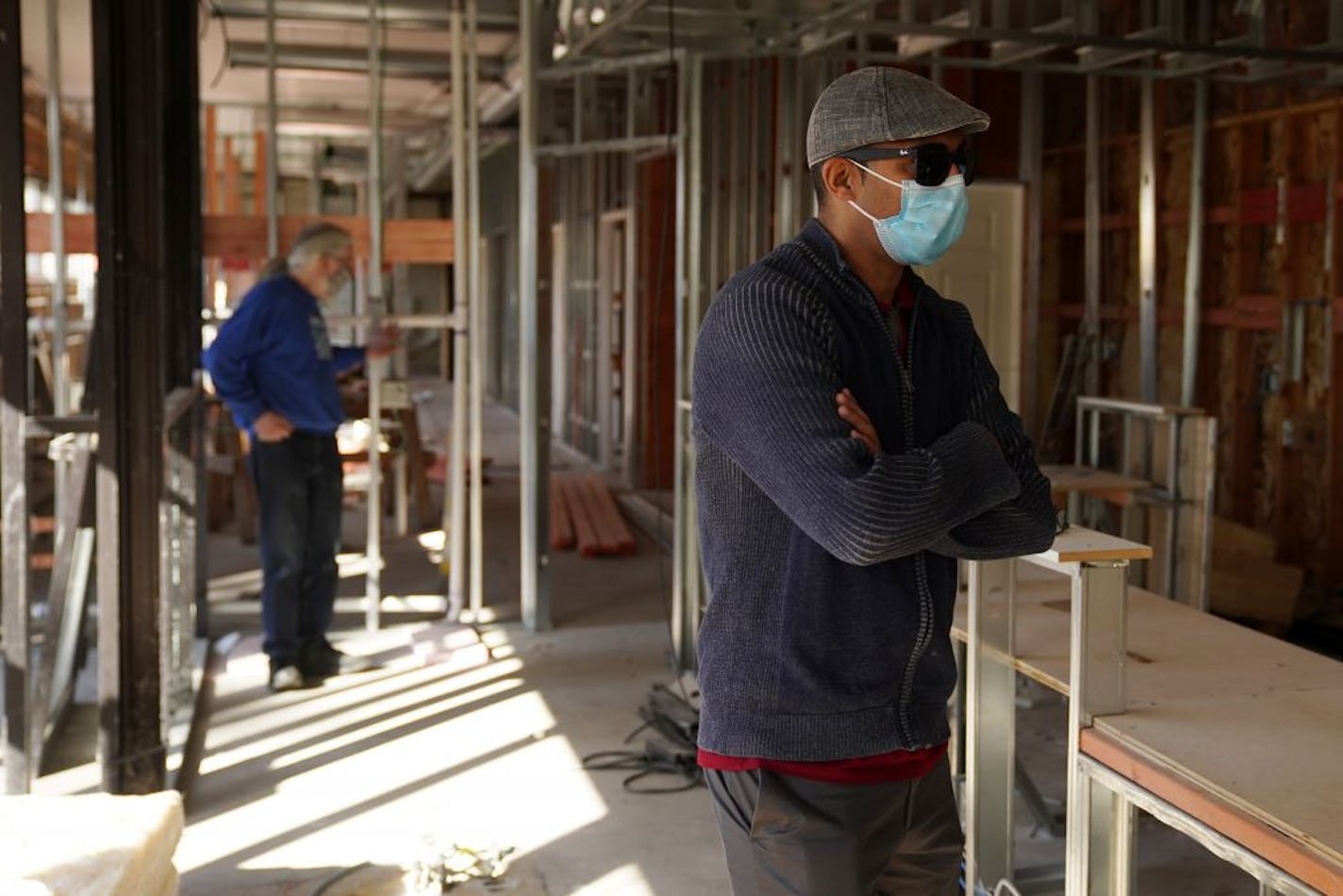 Dr. Ali Barbarawi, a dentist whose practice is in the building neighboring Uncle Hugo's, toured the remodeling work being done to his clinic after it was heavily damaged in the riots following the death of George Floyd.