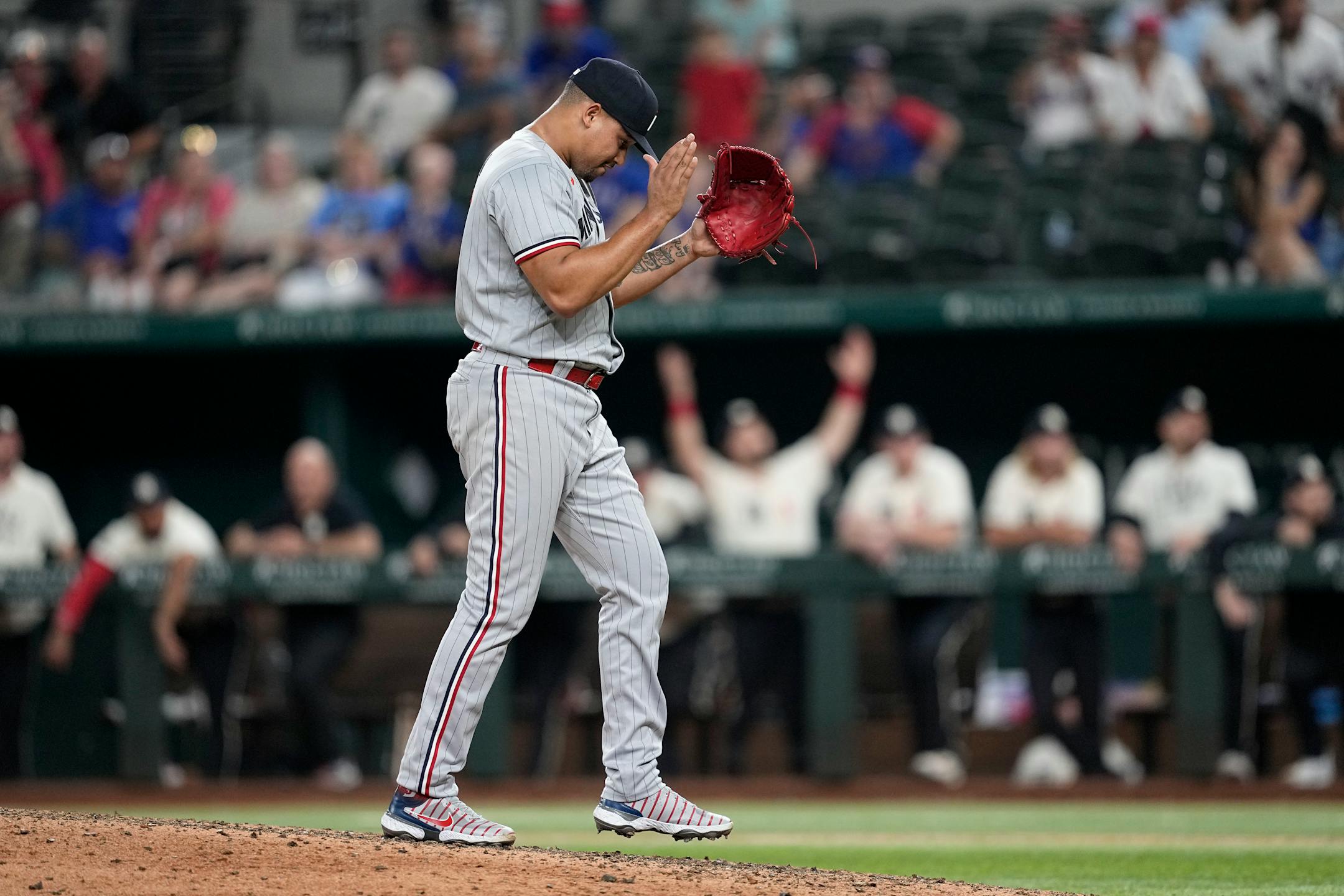 Minnesota Twins relief pitcher Jhoan Duran celebrates after striking out Texas Rangers' Josh Smith for the final out in the 10th inning of a baseball game Saturday, Sept. 2, 2023, in Arlington, Texas. (AP Photo/Tony Gutierrez)