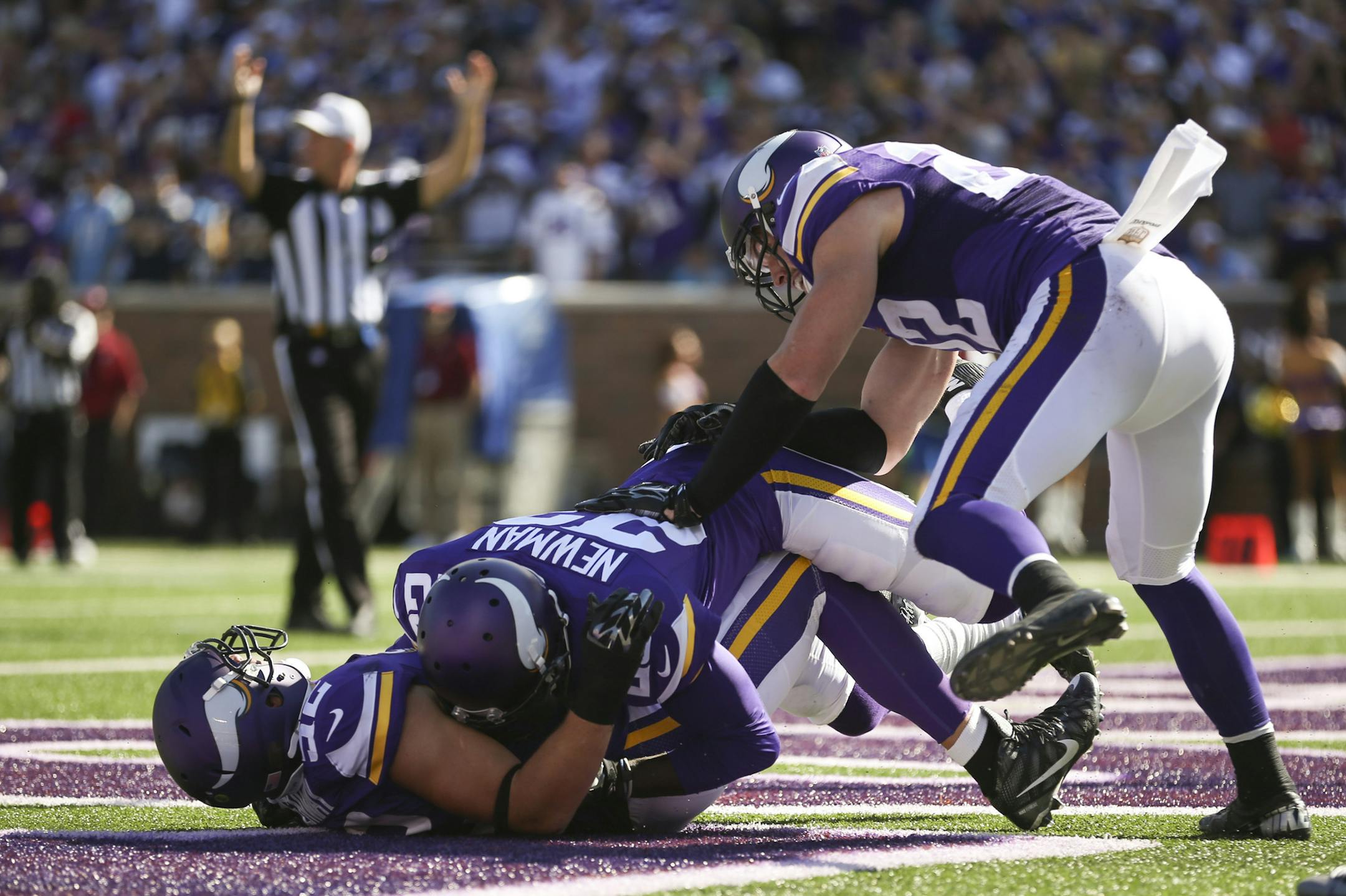 Linebacker Chad Greenway (52) celebrated his interception return against San Diego with fellow veteran Terence Newman.