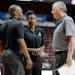 FILE - In this May 4, 2016 file photo, San Antonio Stars coach Dan Hughes talks with assistant coaches James Wade, left, and Vickie Johnson, center, d