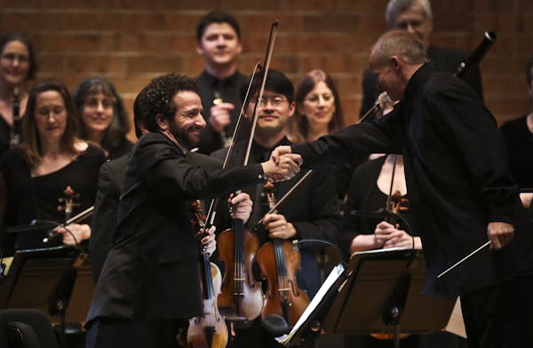 Conductor Thomas Zehetmair, right, shook hands with concertmaster Steven Copes after the St. Paul Chamber Orchestra&#x2019;s first piece Thursday nigh