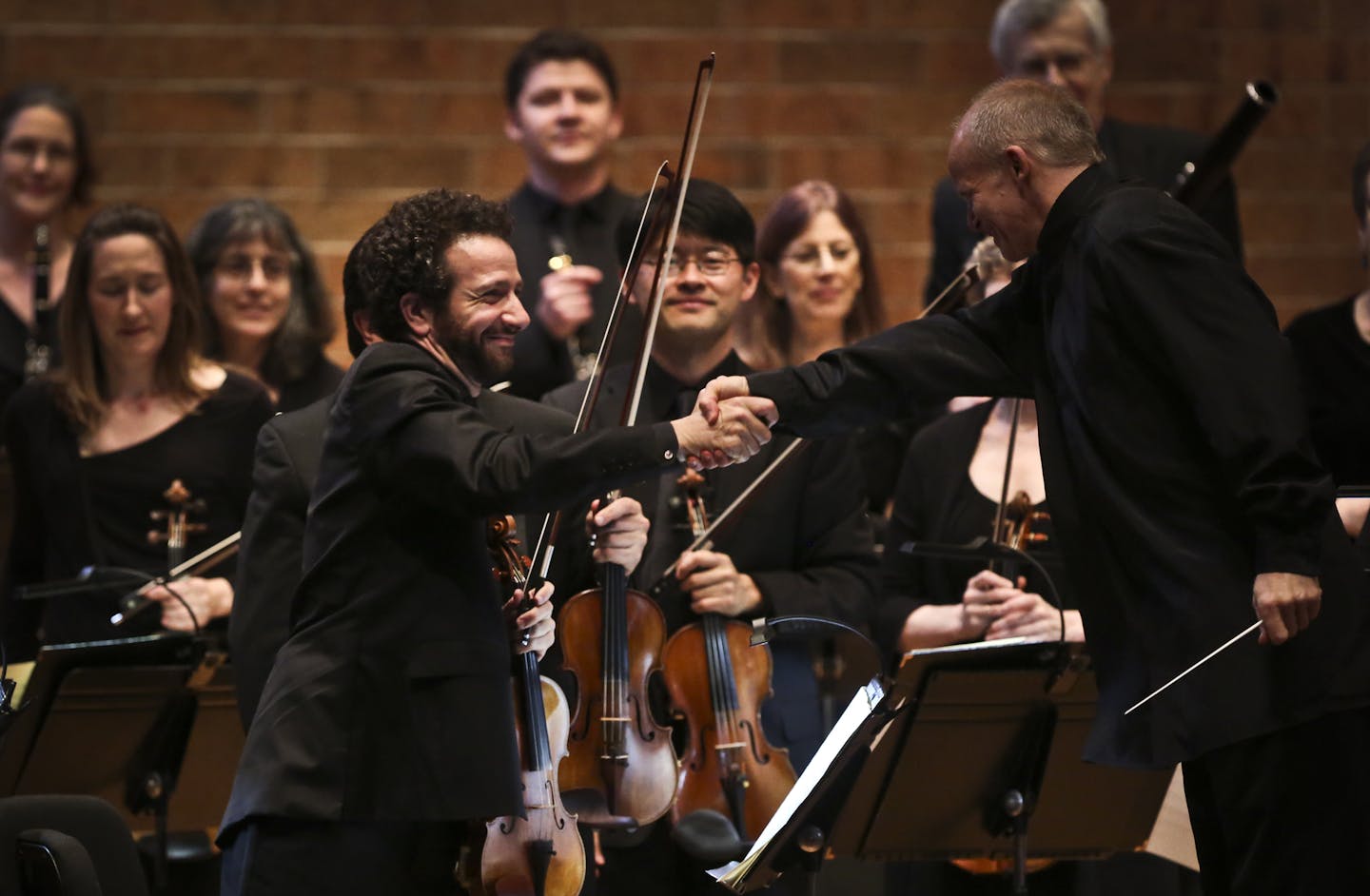 Conductor Thomas Zehetmair, right, shook hands with concertmaster Steven Copes after the St. Paul Chamber Orchestra&#x2019;s first piece Thursday night.