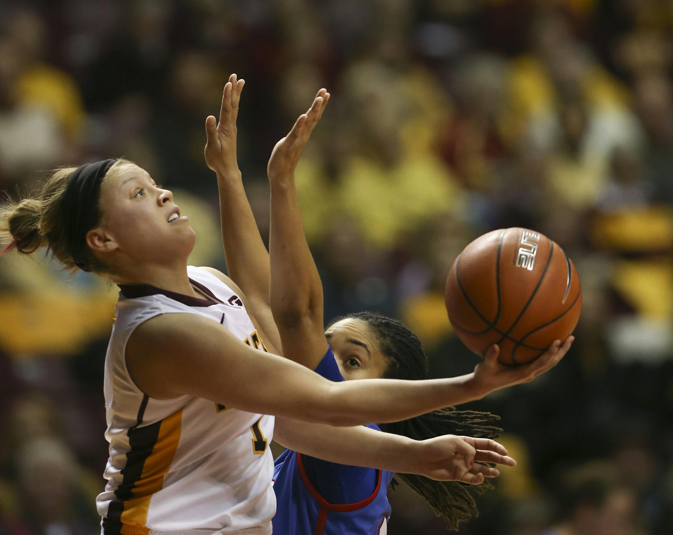 Gophers guard Rachel Banham (1) made a shot from behind the backboard while defended by Southern Methodist Mustangs guard Keena Mays (23) in the first half. ] JEFF WHEELER &#x201a;&#xc4;&#xa2; jeff.wheeler@startribune.com The Minnesota Gophers women met Southern Methodist University in a second round NIT game at Williams Arena in Minneapolis Sunday night, March 23, 2014