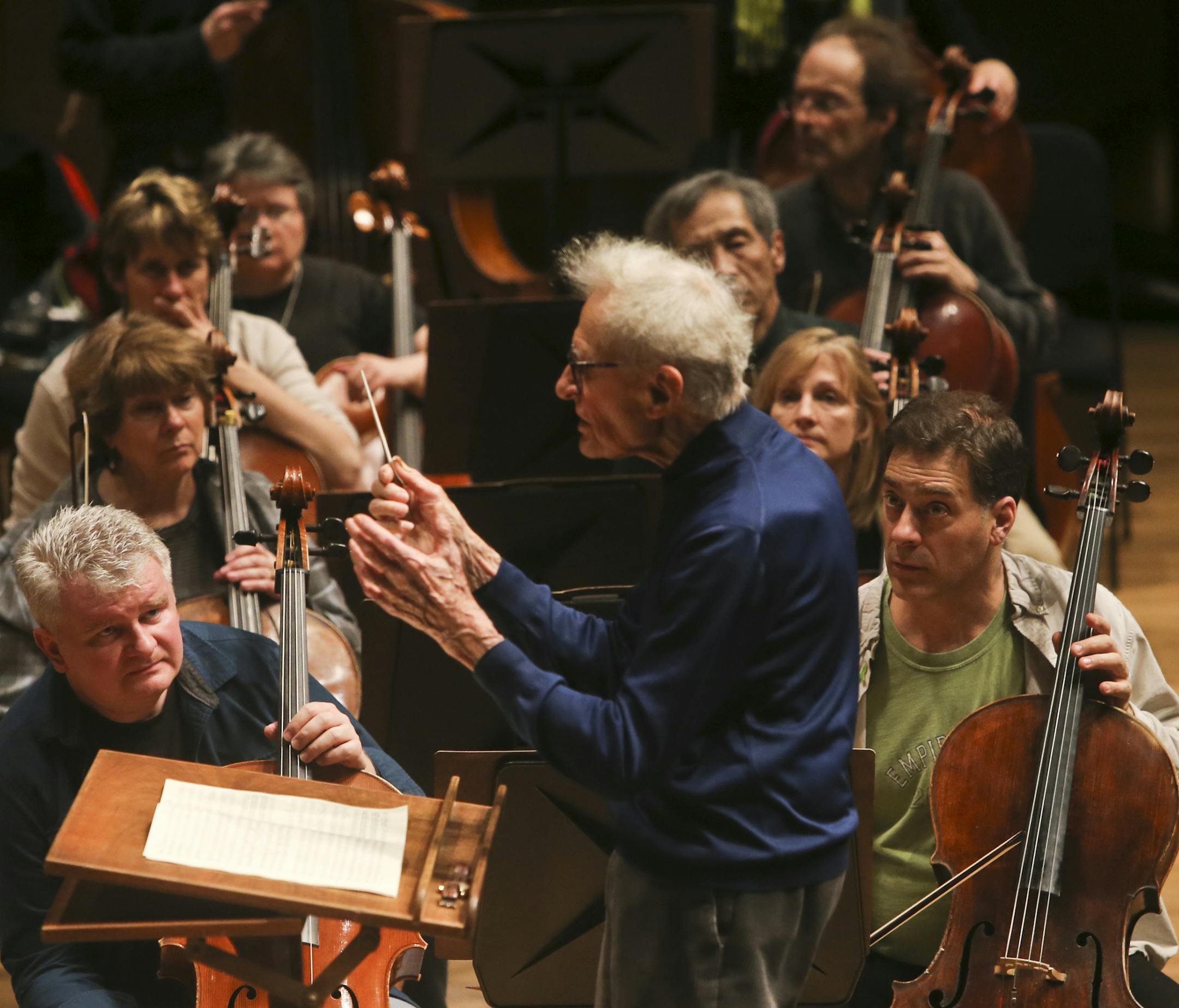 Musicians of the Minnesota Orchestra rehearsed Wednesday, Feb. 5, 2014, at Orchestra Hall for first time in more than 16 months, as they prepared for a homecoming concert at Orchestra Hall this coming Friday night in Minneapolis, MN. Here, conductor laureate Stanislaw Skrowaczewski coached the orchestra as members of the string section listened in during the rehearsal.](DAVID JOLES/STARTRIBUNE) djoles@startribune.com Musicians of the Minnesota Orchestra rehearsed Wednesday, Feb. 5, 2014, at Orch