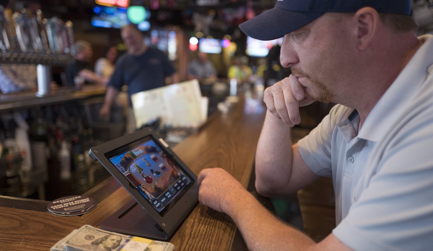 Jay Hazeman played electronic pull-tabs at the 1029 bar Tuesday May 1, 2018. ] JERRY HOLT &#xef; jerry.holt@startribune.com