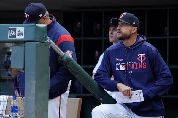 Minnesota Twins manager Rocco Baldelli (5) watched from the dugout Thursday.