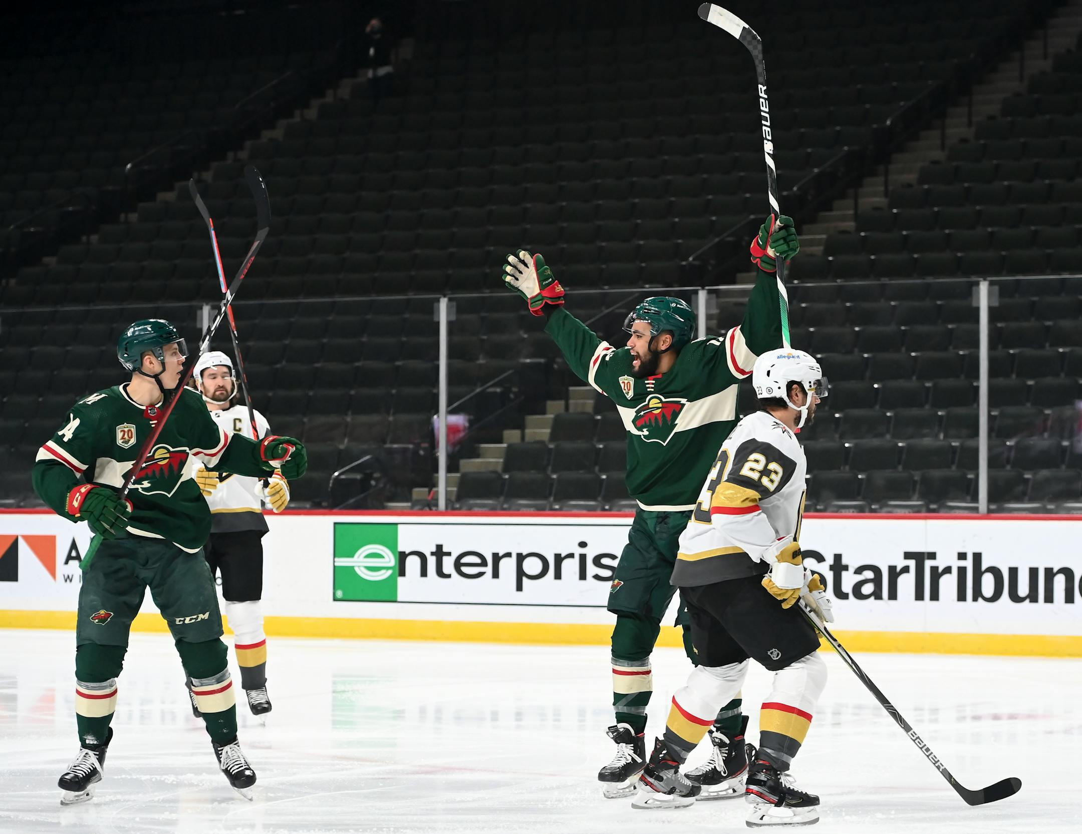 Minnesota Wild center Joel Eriksson Ek (14) and left wing Jordan Greenway (18) celebrated a goal by Eriksson Ek early in the first period against the Vegas Golden Knights.