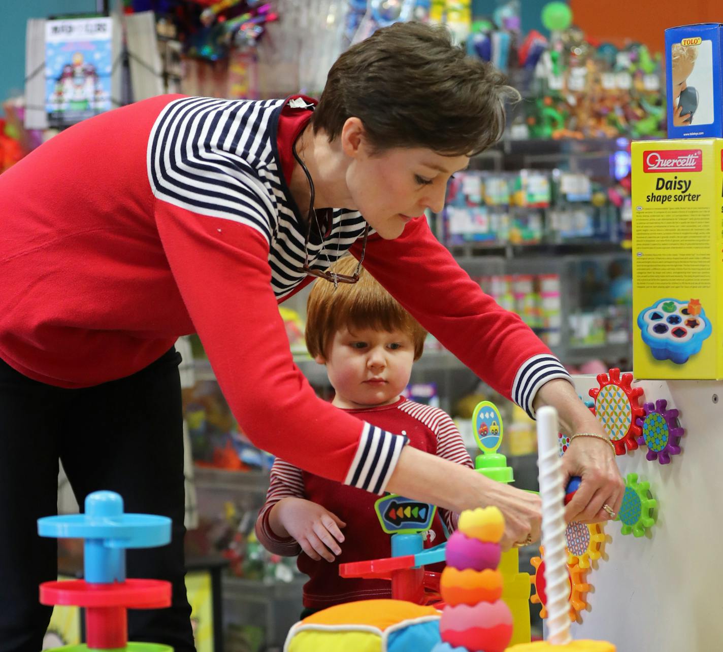 Flying Circus Toys owner Jessica Persons played with two-year old Dominic Rorman inside the store. ] Shari L. Gross / sgross@startribune.com Flying Circus Toys in the Albertville Premium Outlet mall has remained successful as an independent toy retailer at a time when even Toys R US struggles. Photographed at Flying Circus Toys in Albertville, Minn., on Wednesday, November 23, 2016.