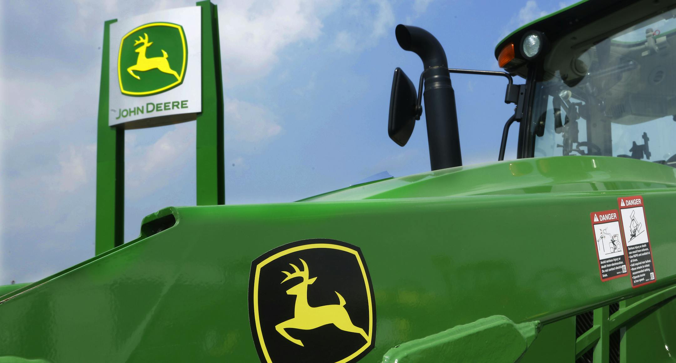 FILE - In this Monday, Aug. 31, 2015, file photo, John Deere equipment is on display at the Farm Progress Show in Decatur, Ill. Deere & Co. reports earnings, Friday, May 19, 2017. (AP Photo/Seth Perlman, File)