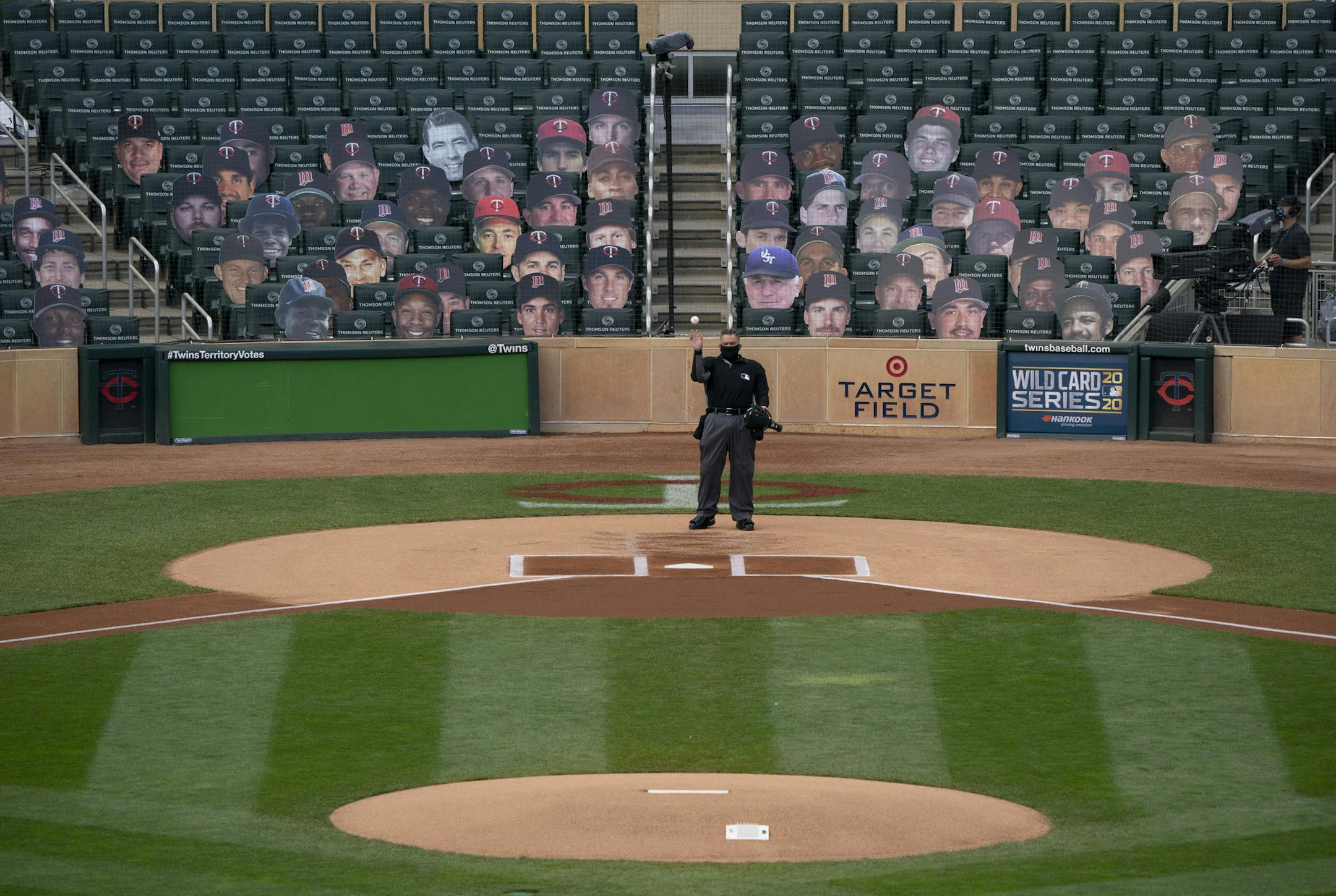 Home plate umpire umpire Manny Gonzalez threw a ball out to the pitcher's mound before the start of Wednesday's game. ] JEFF WHEELER • jeff.wheeler@startribune.com The Minnesota Twins lost to the Houston Astros 3-1 in Game 2 of their MLB Wild Card Series Tuesday afternoon, September 30, 2020 at Target Field in Minneapolis.