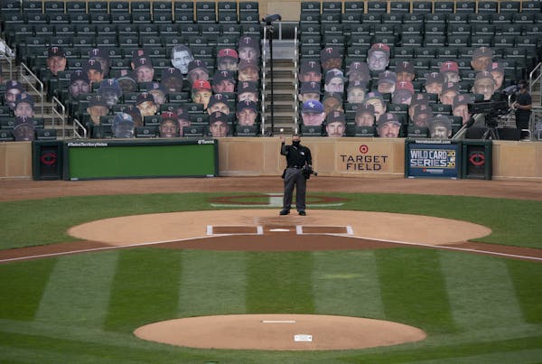 Home plate umpire umpire Manny Gonzalez threw a ball out to the pitcher's mound before the start of Wednesday's game. ] JEFF WHEELER • jeff.wheeler@