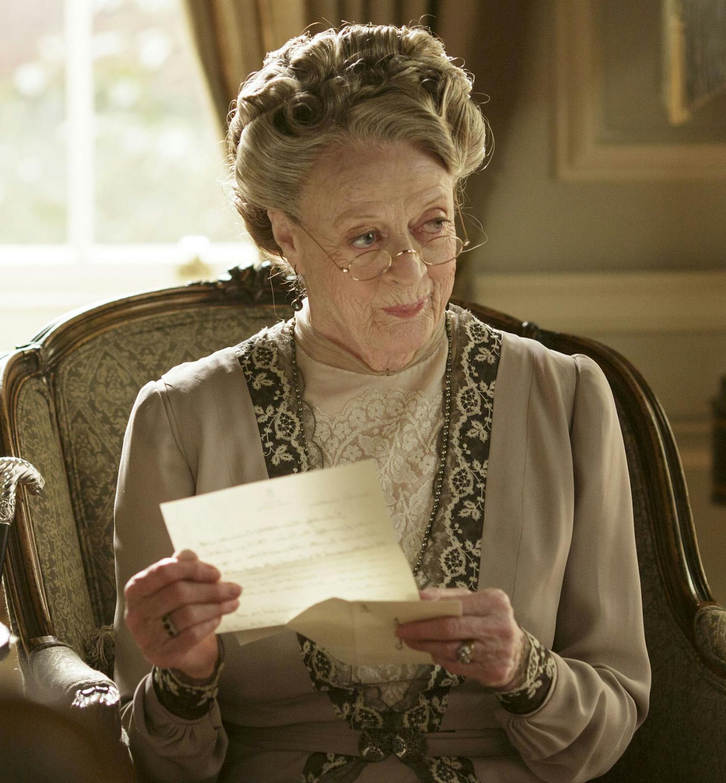 This image released by PBS shows Maggie Smith as Violet, Dowager Countess of Grantham in a scene from the final season of "Downton Abbey." The series finale airs in the U.S. on Sunday. (Nick Briggs/Carnival Film & Television Limited 2015 for MASTERPIECE via AP)