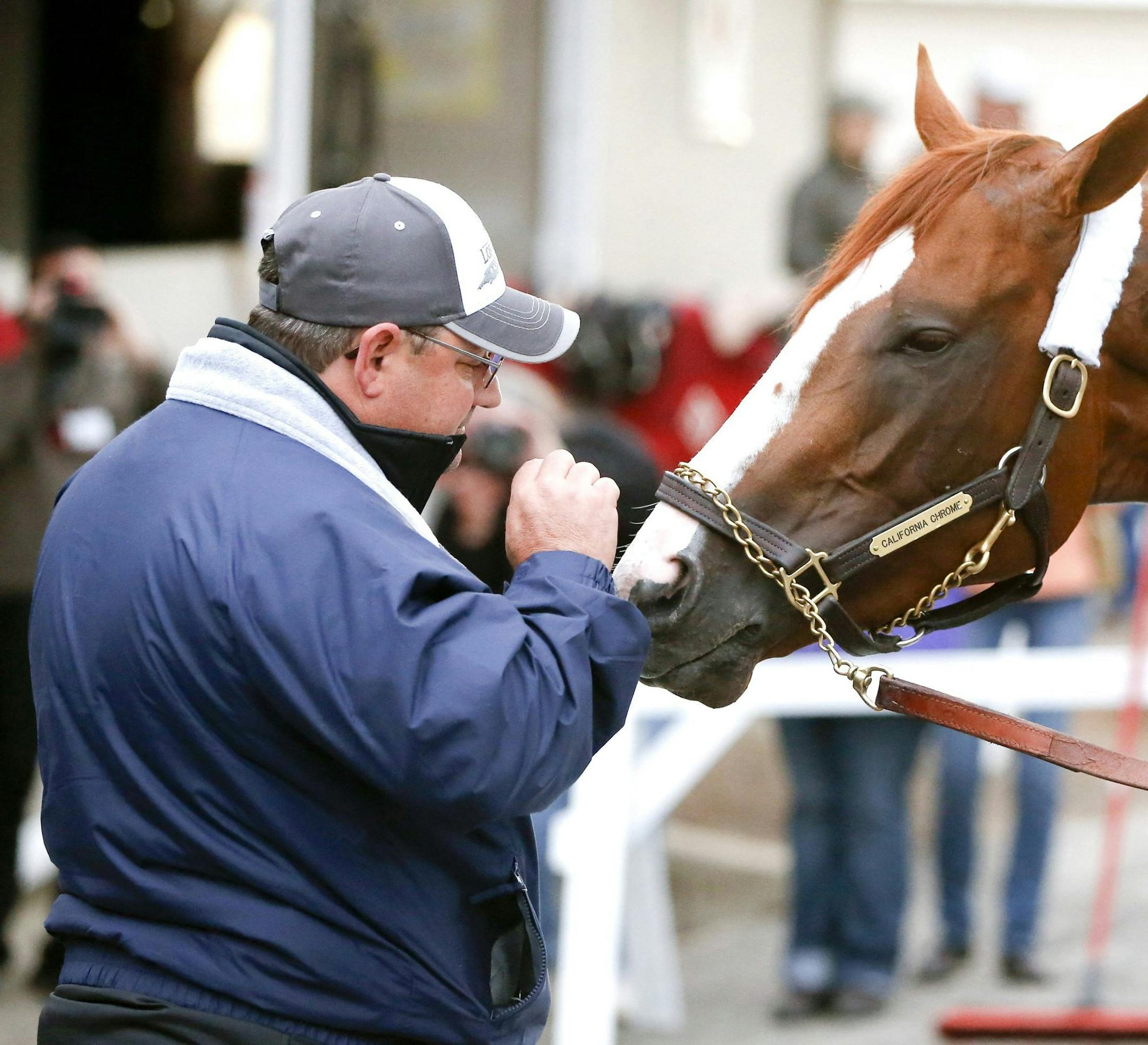 Alan Sherman plays around with California Chrome during a bath after an early morning workout on Thursday, May 1, 2014, at Churchill Downs in Louiville, Ky., as horses prepare for the Kentucky Derby. (Mark Cornelison/Lexington Herald-Leader/MCT) ORG XMIT: 1152310