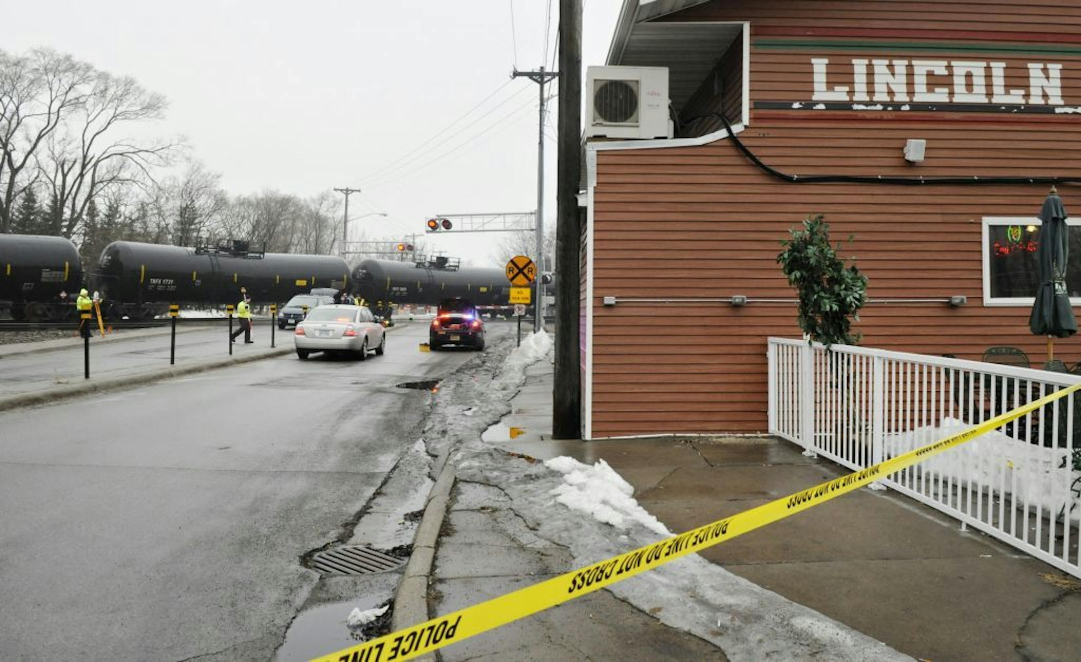 The Minnesota State Patrol investigates the scene after a pedestrian was hit by a train Thursday, March 27, 2014 at the Seventh Street Southeast train crossing near Lincoln Avenue in St. Cloud, Minn. The incident happened about 7 a.m. Thursday.