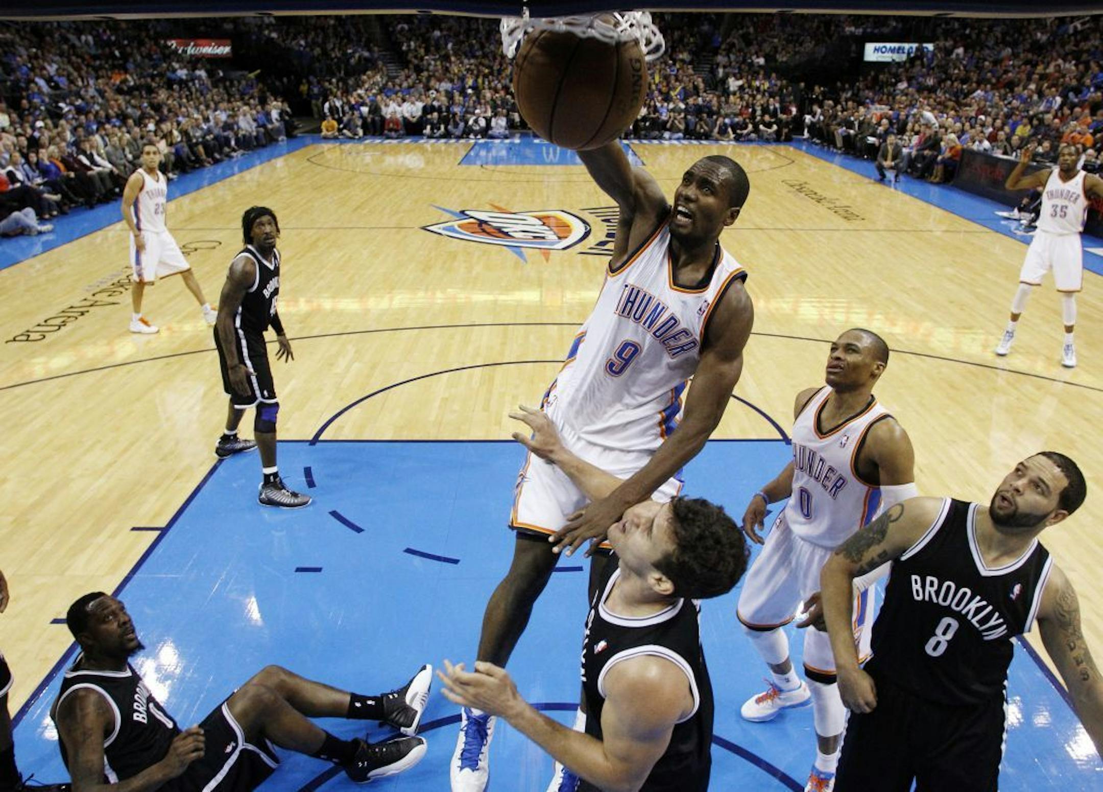 Oklahoma City Thunder forward Serge Ibaka (9) dunks against the Brooklyn Nets in the second quarter of an NBA basketball game in Oklahoma City, Wednesday, Jan. 2, 2013. Brooklyn won 110-93.