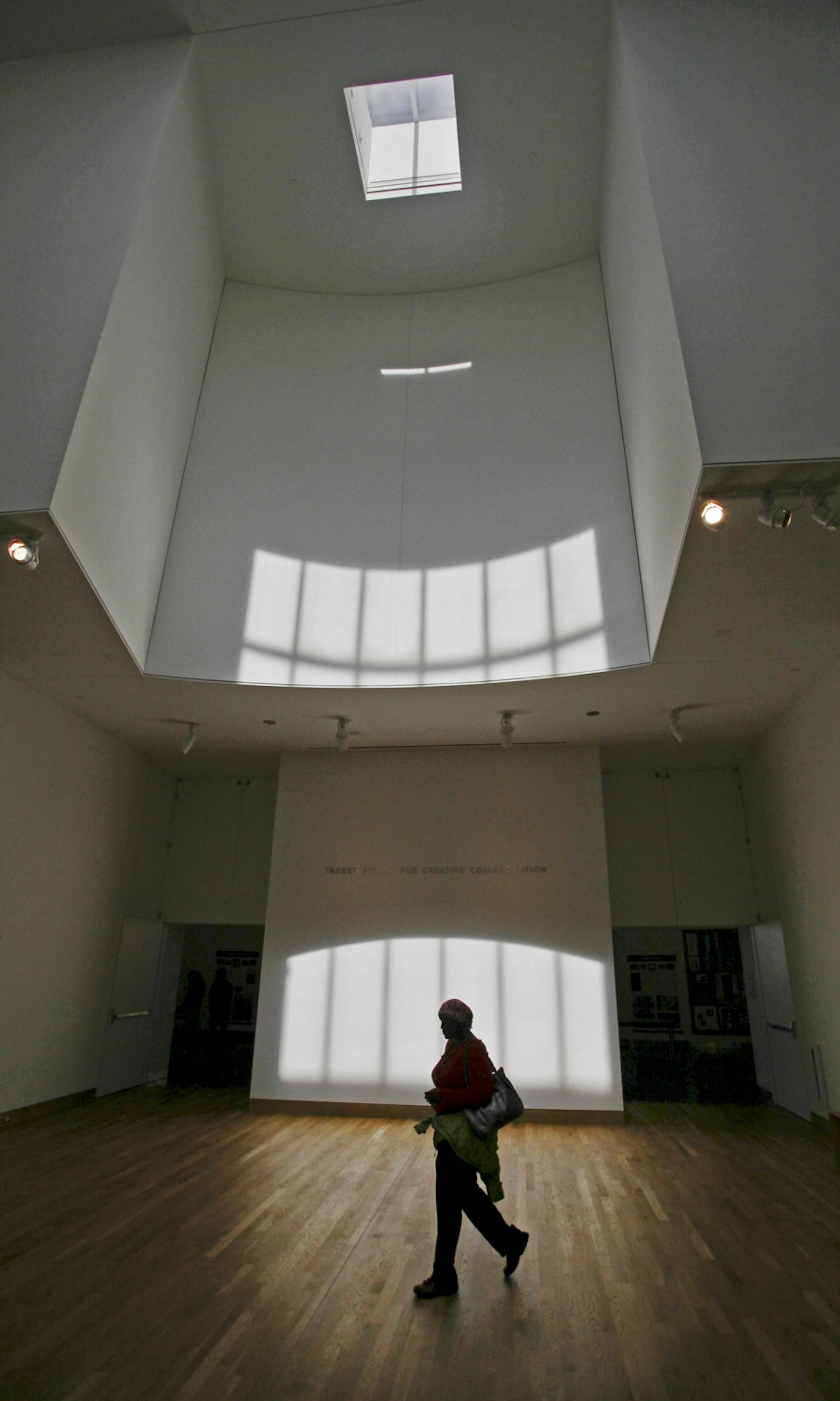 The interior of the Frank Gehry designed museum is open with many windows and constantly shifting light at the Frederick R. Weisman Art Museum in Minneapolis, MN.