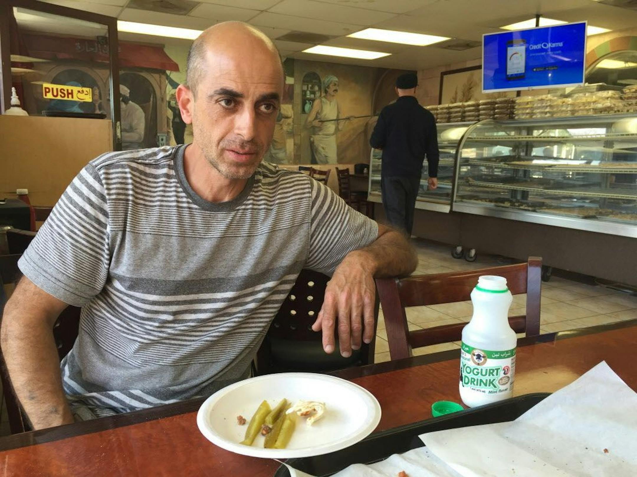 Max Chashku, a naturalized U.S. citizen who came to Orange County, Calif., from Syria 20 years ago, pauses to speak about Republican presidential candidate Sen. Ted Cruz's remarks about Muslim Americans, as he eats at Forn Al Hala restaurant in Orange County's Little Arabia in Anaheim, Calif., Tuesday, March 22, 2016. Republican presidential candidate Ted Cruz said Tuesday that surveillance in Muslim neighborhoods in the U.S. must be intensified following the deadly bombings at Brussels, while r