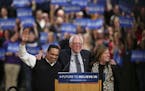 Minnesota&#x2019;s U.S. Rep. Keith Ellison stood with Sen. Bernie Sanders and his wife, Jane O&#x2019;Meara Sanders, after introducing the Democratic 
