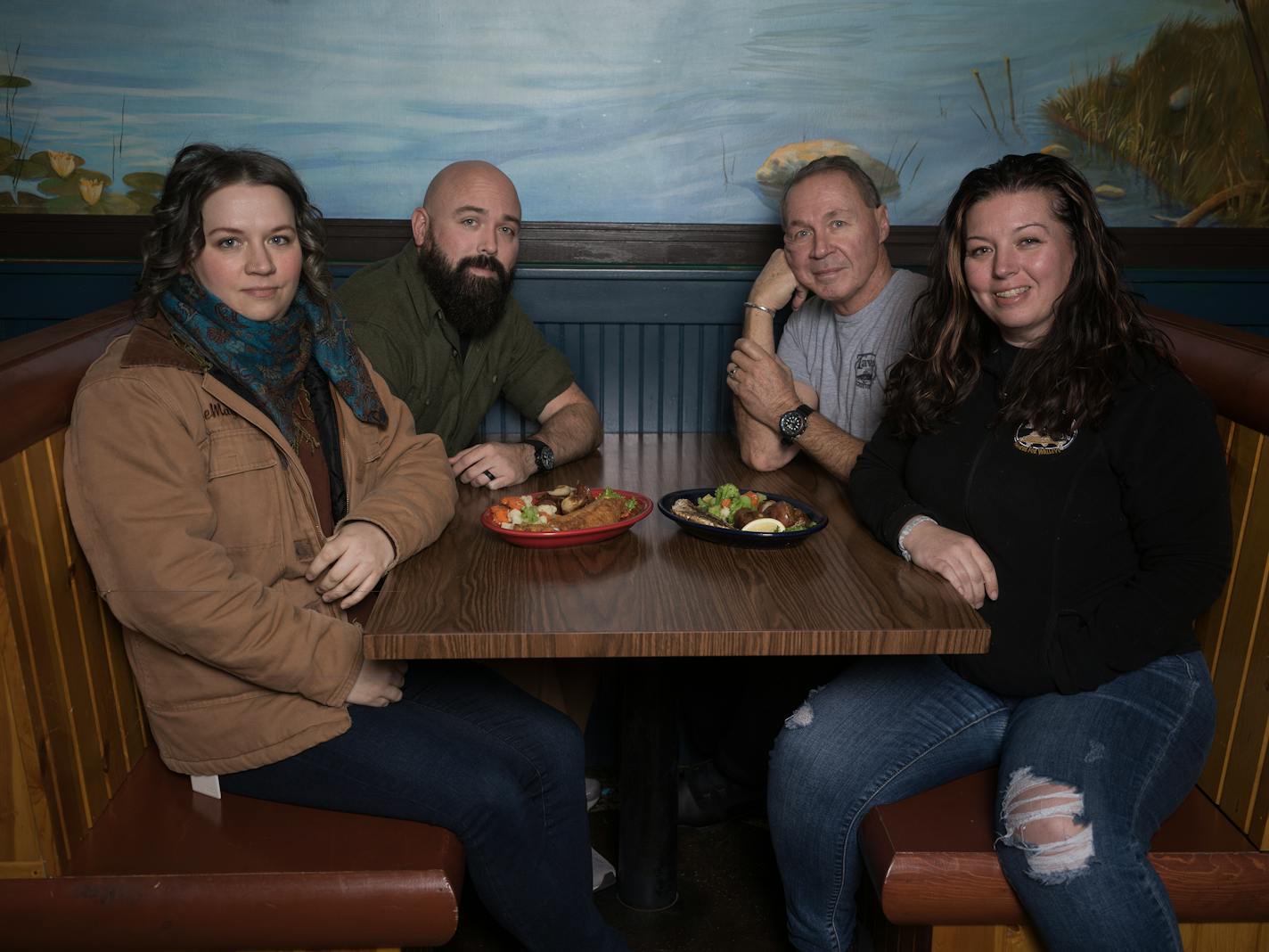 Ashley LeMay, Eric LeMay, Daniel Ryan, and Tara Padilla( L to R) are owners of the soon to be closed Tavern on Grand in St. Paul, Minn., on Thursday, Jan. 11, 2024. Tavern on Grand, 35-year-old family-owned restaurant, becomes the latest Grand Ave. casualty when it closes this summer ] RICHARD TSONG-TAATARII • richard.tsong-taatarii @startribune.com