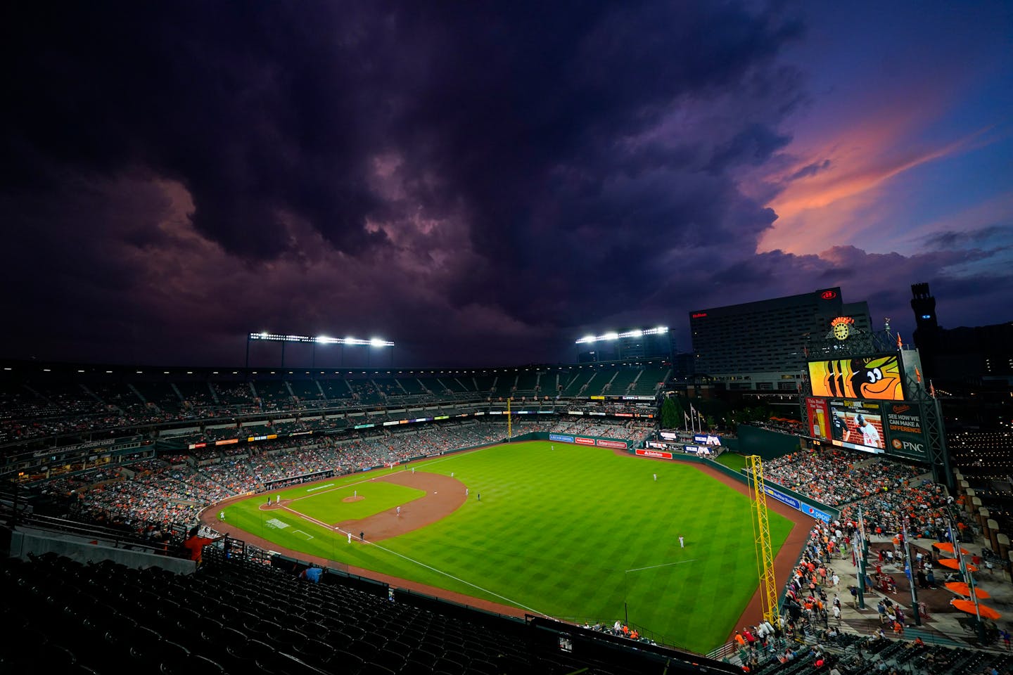 Clouds roll in over Oriole Park at Camden Yards in the sixth inning of a baseball game between the Baltimore Orioles and the Cincinnati Reds, Tuesday, June 27, 2023, in Baltimore. (AP Photo/Julio Cortez)