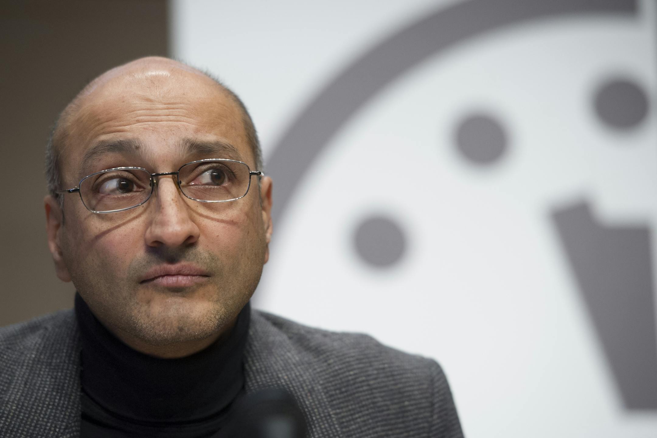 Sivan Kartha, member, Science and Security Board, Bulletin of the Atomic Scientists, listens during a news conference to announce that the Doomsday Clock has been reset to show three minutes until midnight, Thursday, Jan. 22, 2015, in Washington. The clock advanced two minutes to midnight, an indication of how near the Earth is to destruction (AP Photo/Cliff Owen)