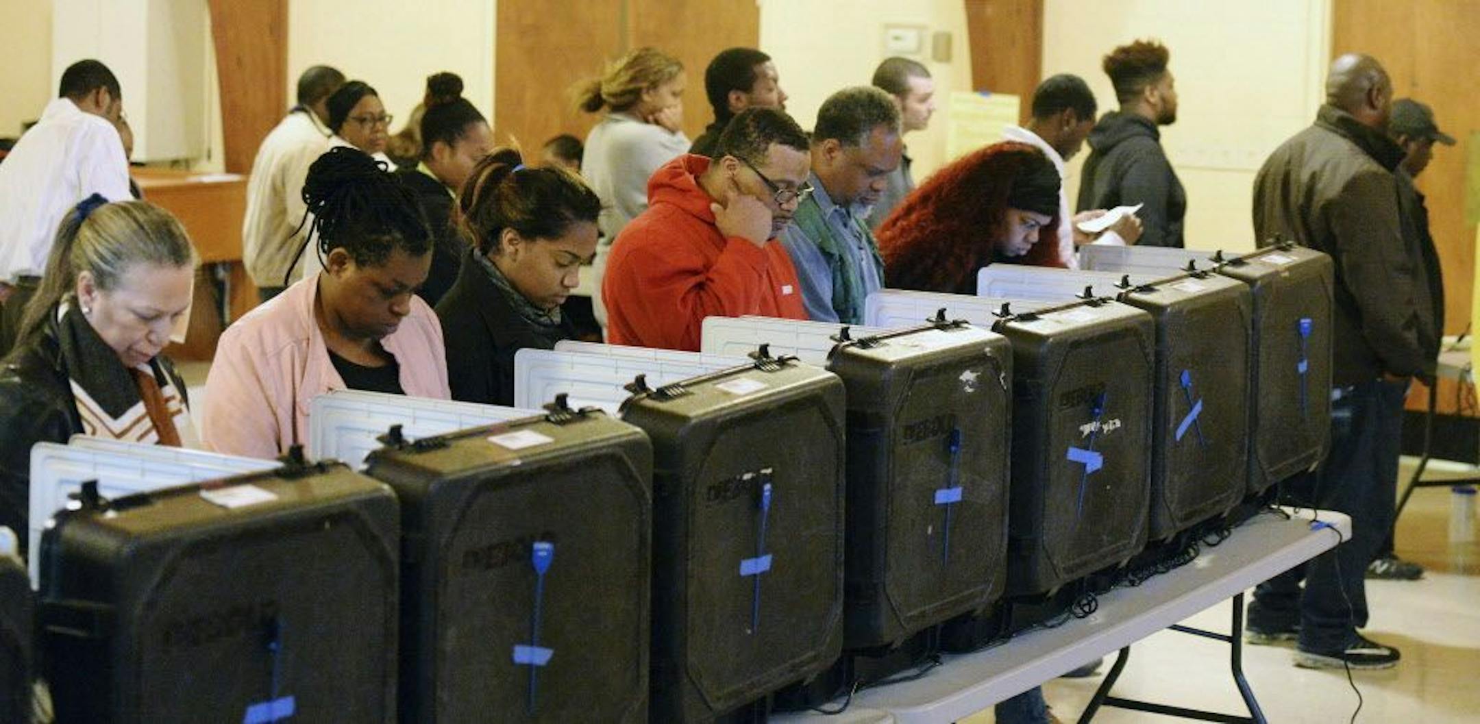 DeKalb County voters go to the polls on Election Day at the Crossroads Presbyterian Church in Stone Mountain, Ga. on Tuesday, Nov. 8, 2016. They join voters across the country in choosing a new President and other elected officials in local and statewide races.