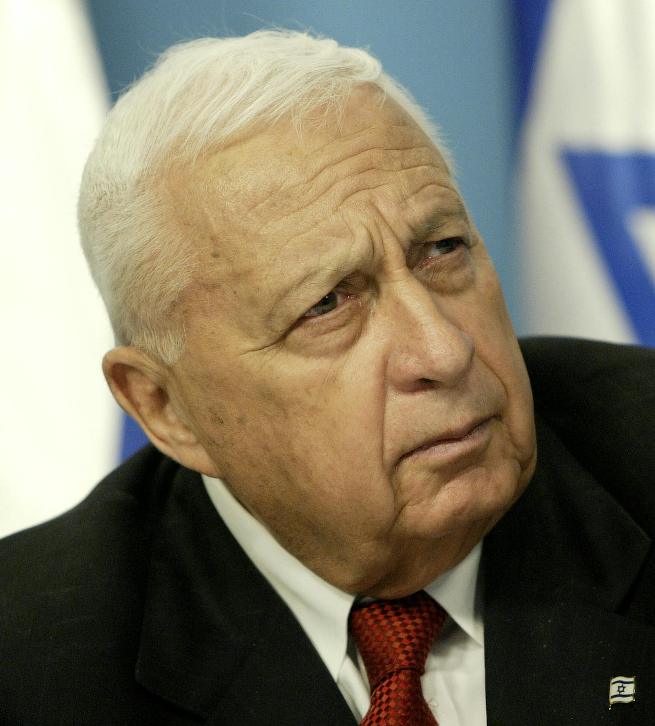 FILE - In this Sunday May 16, 2004 file photo, Israeli Prime Minister Ariel Sharon pauses during a news conference in his Jerusalem office regarding education reform. Israeli media outlets are reporting that Sharon has died Saturday, Jan. 11, 2014 at the age of 85. (AP Photo/Oded Balilty, File) ORG XMIT: MIN2014011113011040