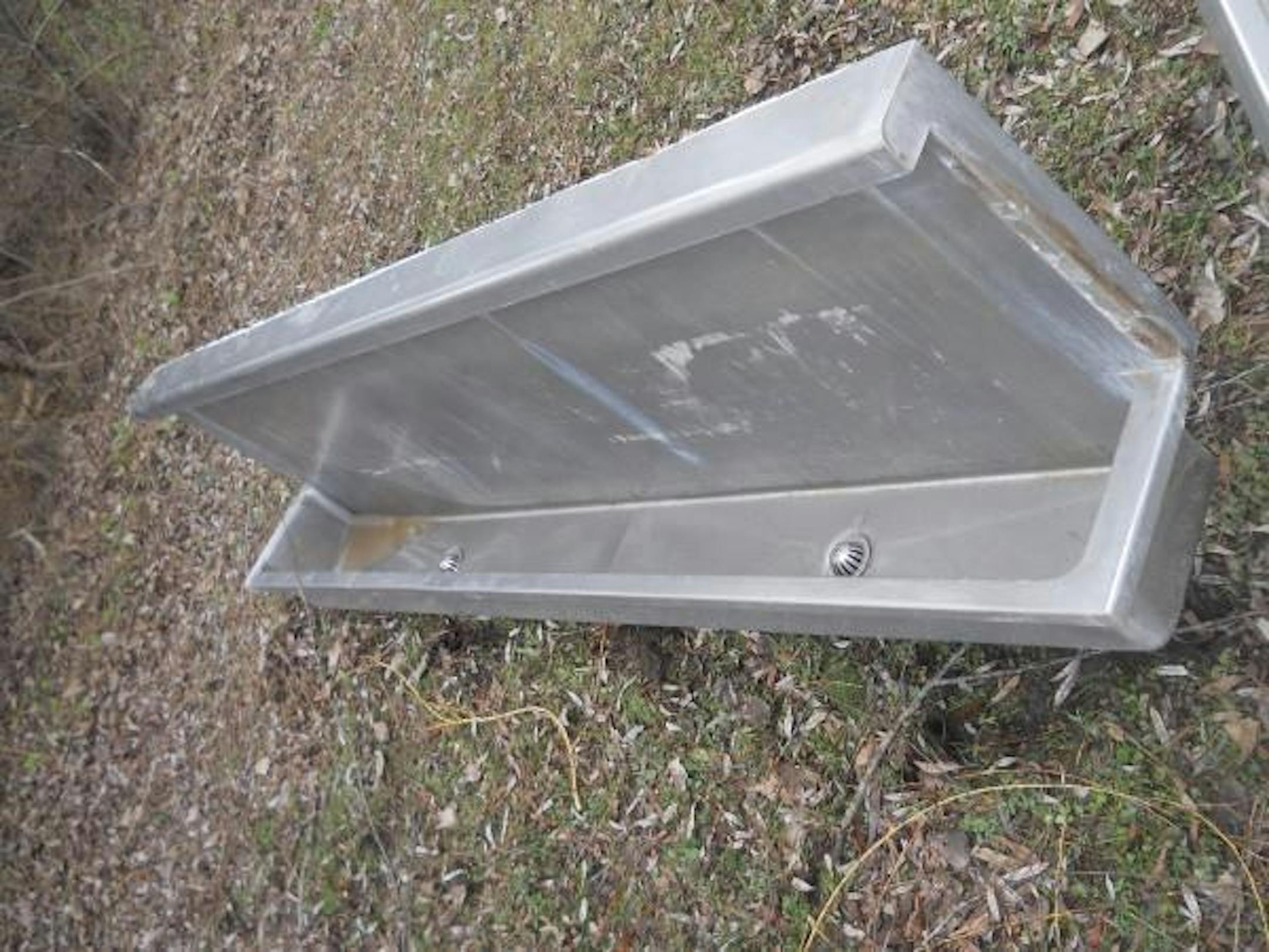 Urinal troughs from the Metrodome are being auctioned off.