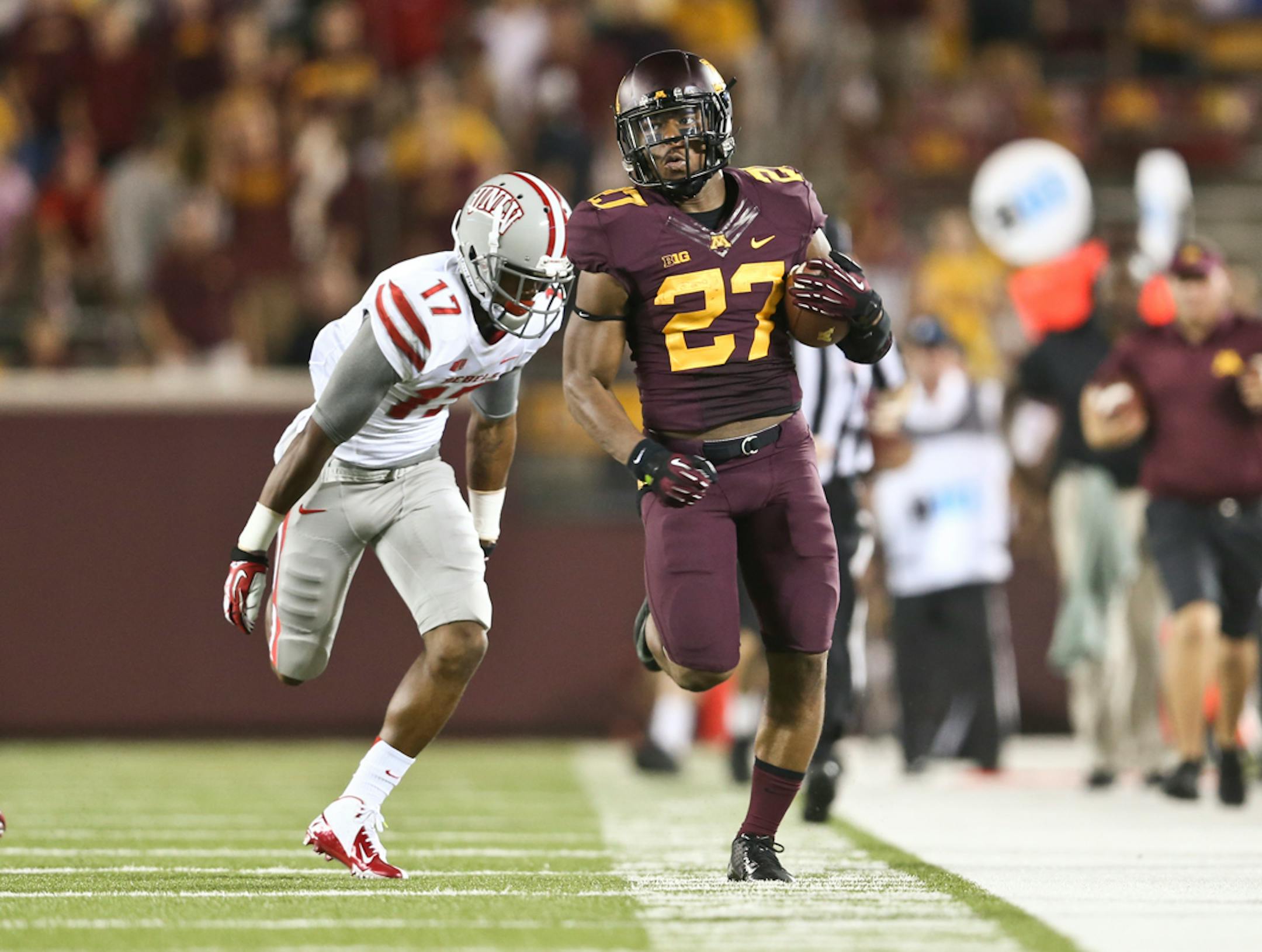 Gophers running back David Cobb ran 60 yards downfield in the fourth quarter before UNLV defensive back Kenneth Penny tackled him